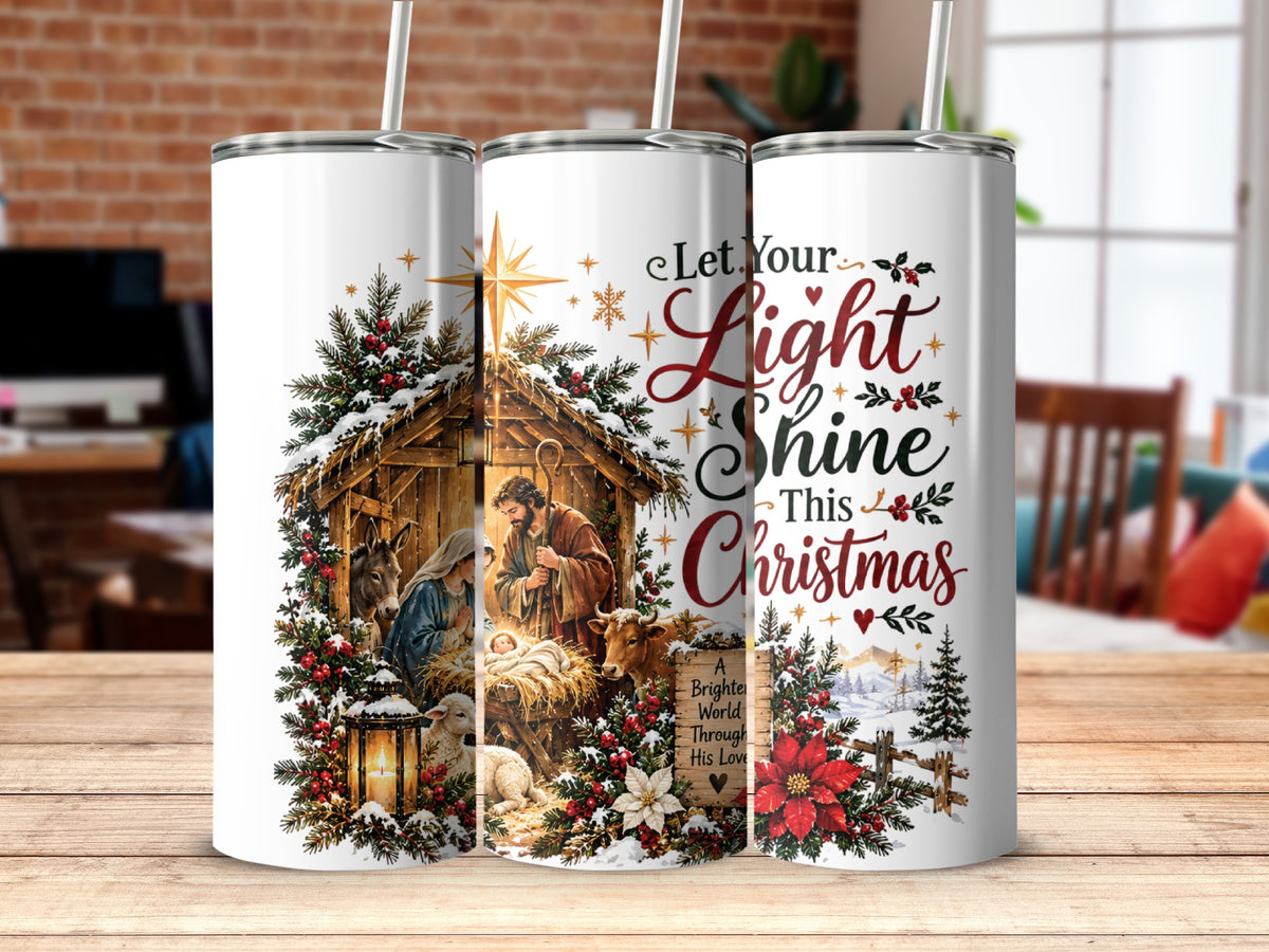 Three white travel tumblers featuring a Christmas nativity scene and the text Let Your Light Shine This Christmas.