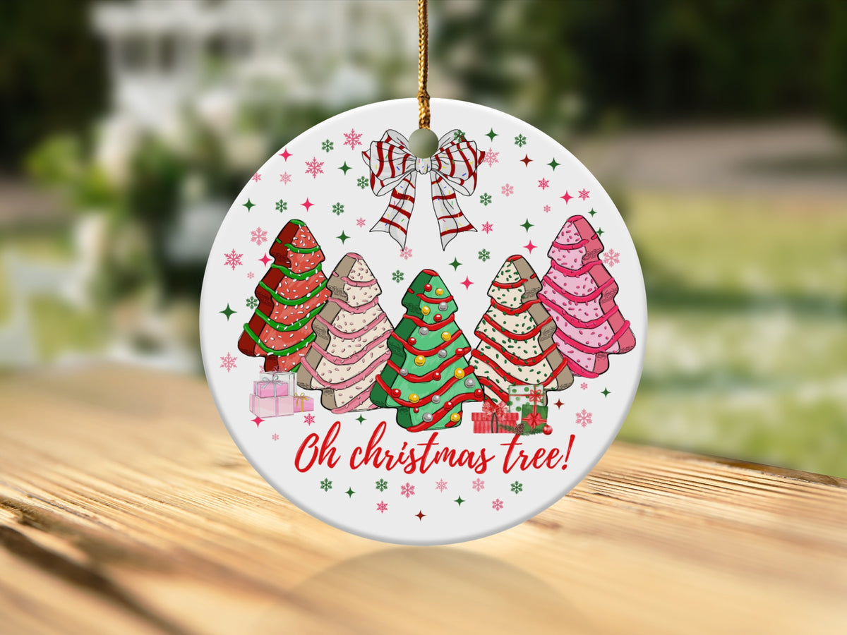 Round ornament with five stylized Christmas trees, gifts, and "Oh christmas tree!" text.