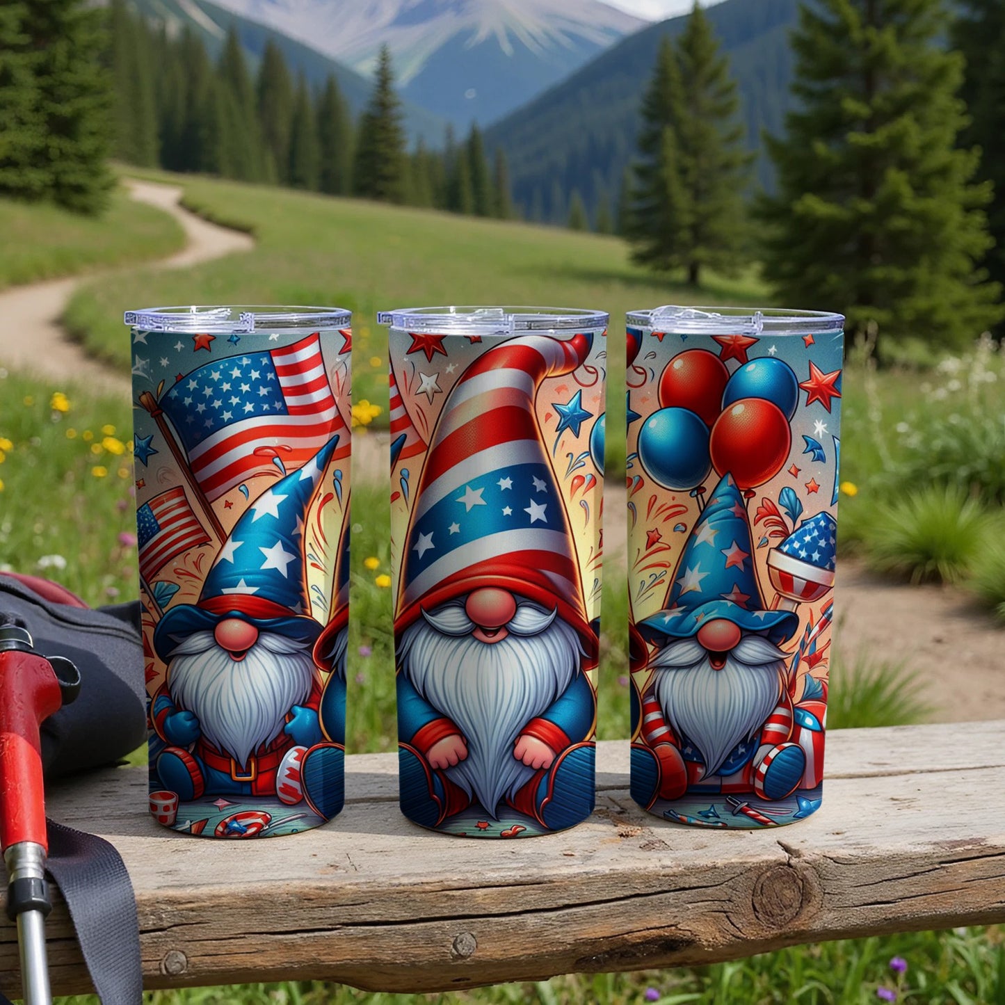 Three patriotic gnomes in festive hats and shirts holding flags and balloons.