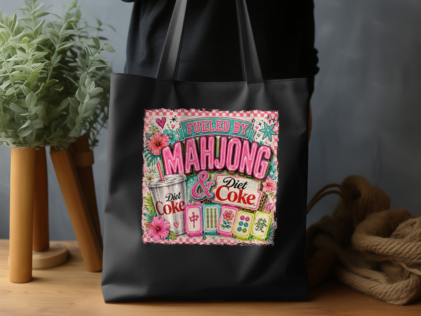 Black tote bag with "Fueled by Mahjong & Diet Coke" design featuring tiles.