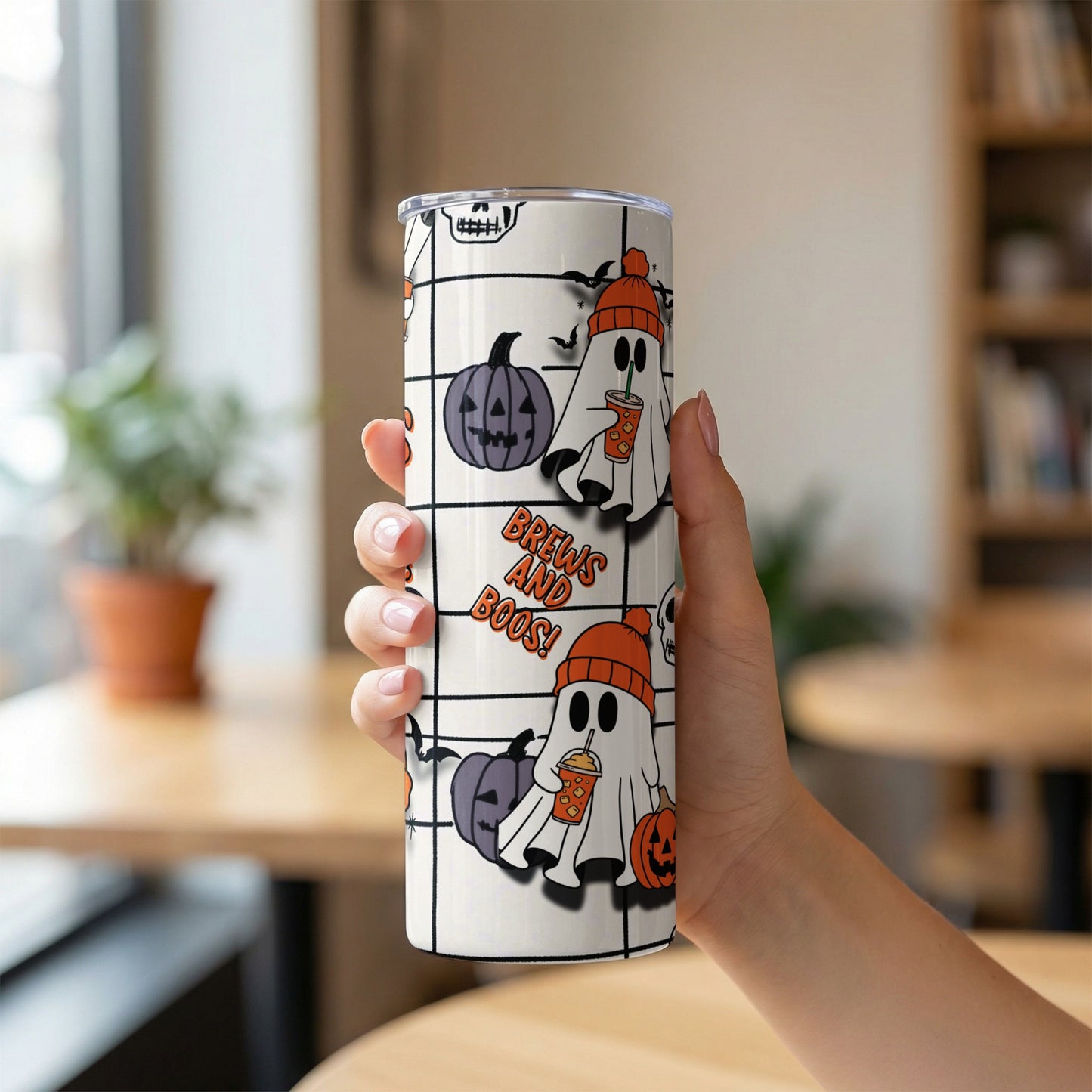 Tumbler with Halloween ghosts, pumpkins, bats, and "Brews and Boos!" text.