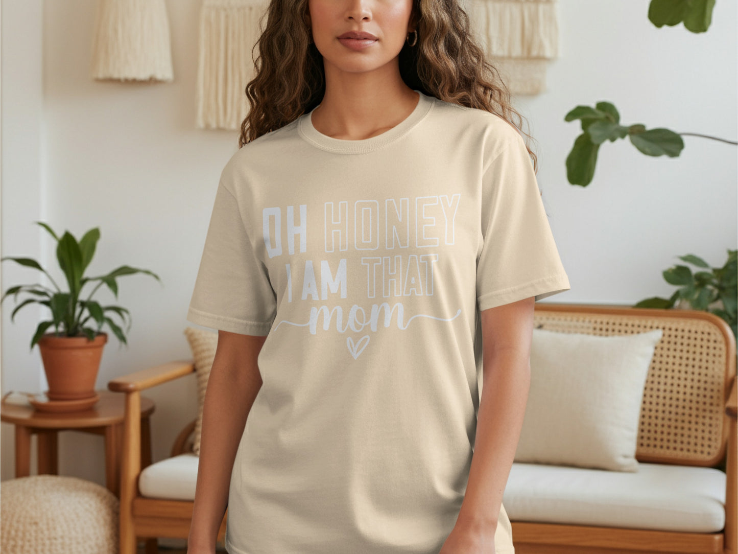Cream t-shirt with "OH HONEY I AM THAT MOM" text and a heart.