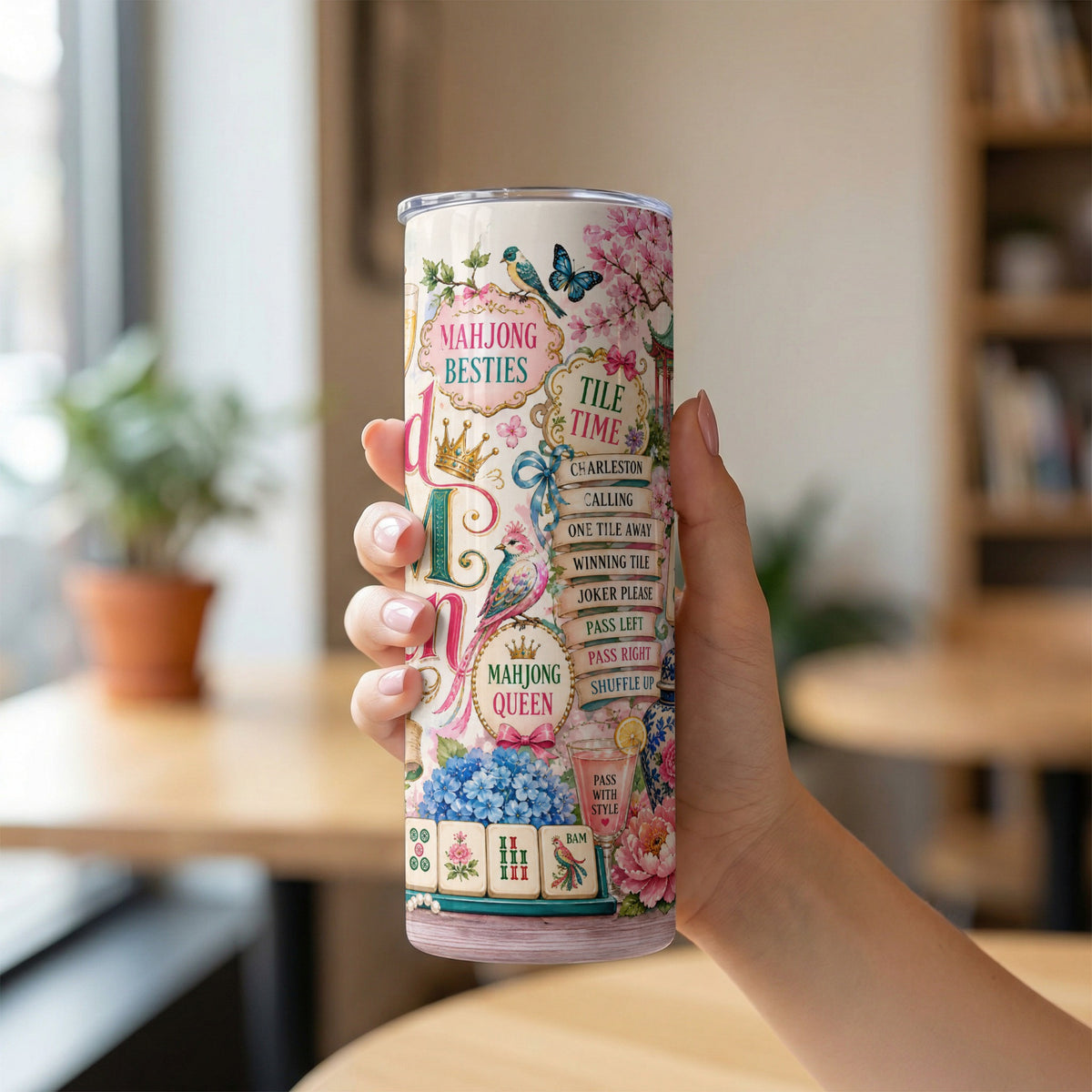 Tumbler with floral patterns, birds, butterflies, mahjong tiles, and text.