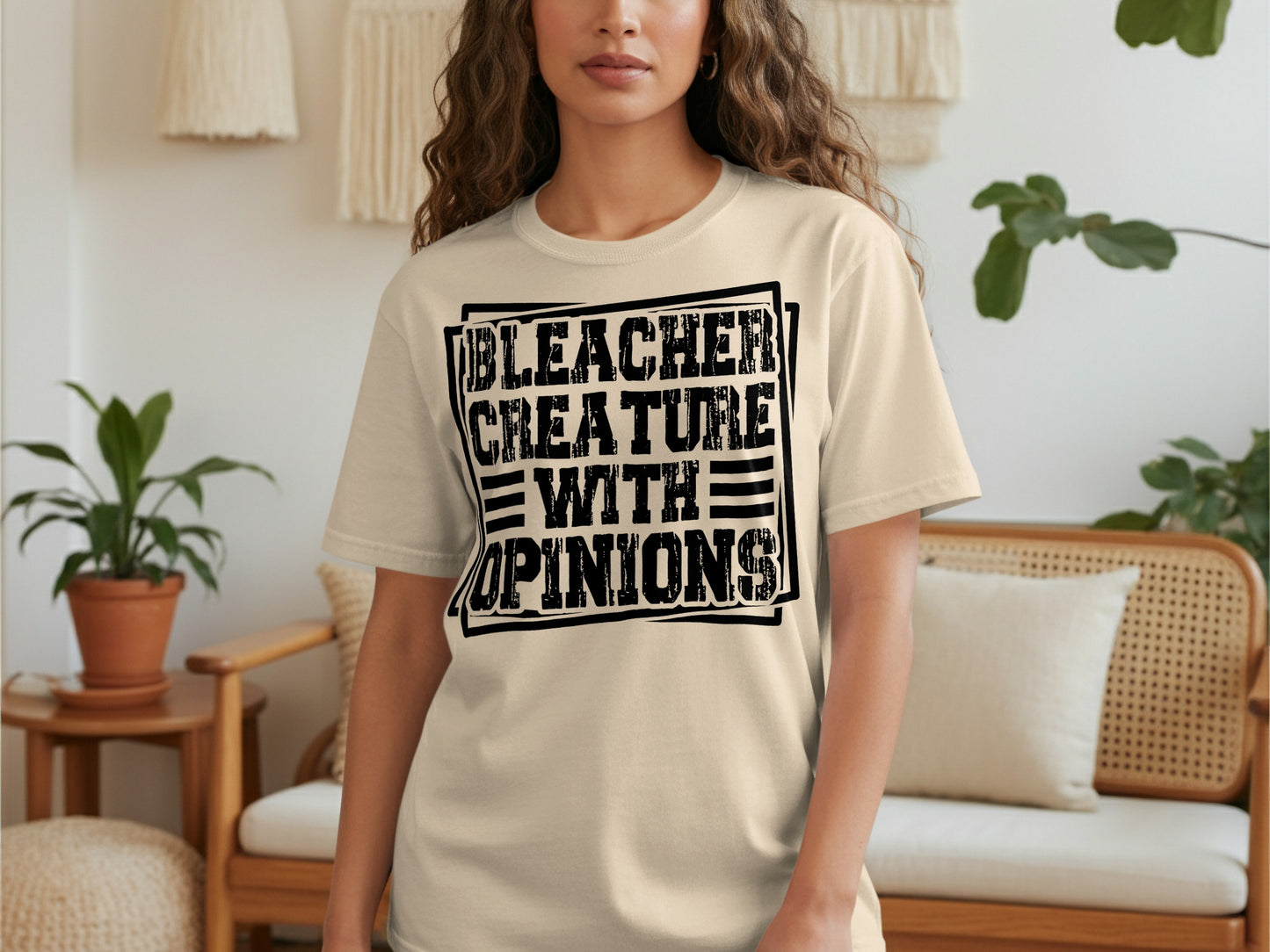 Cream t-shirt with black text reading "BLEACHER CREATURE WITH OPINIONS".