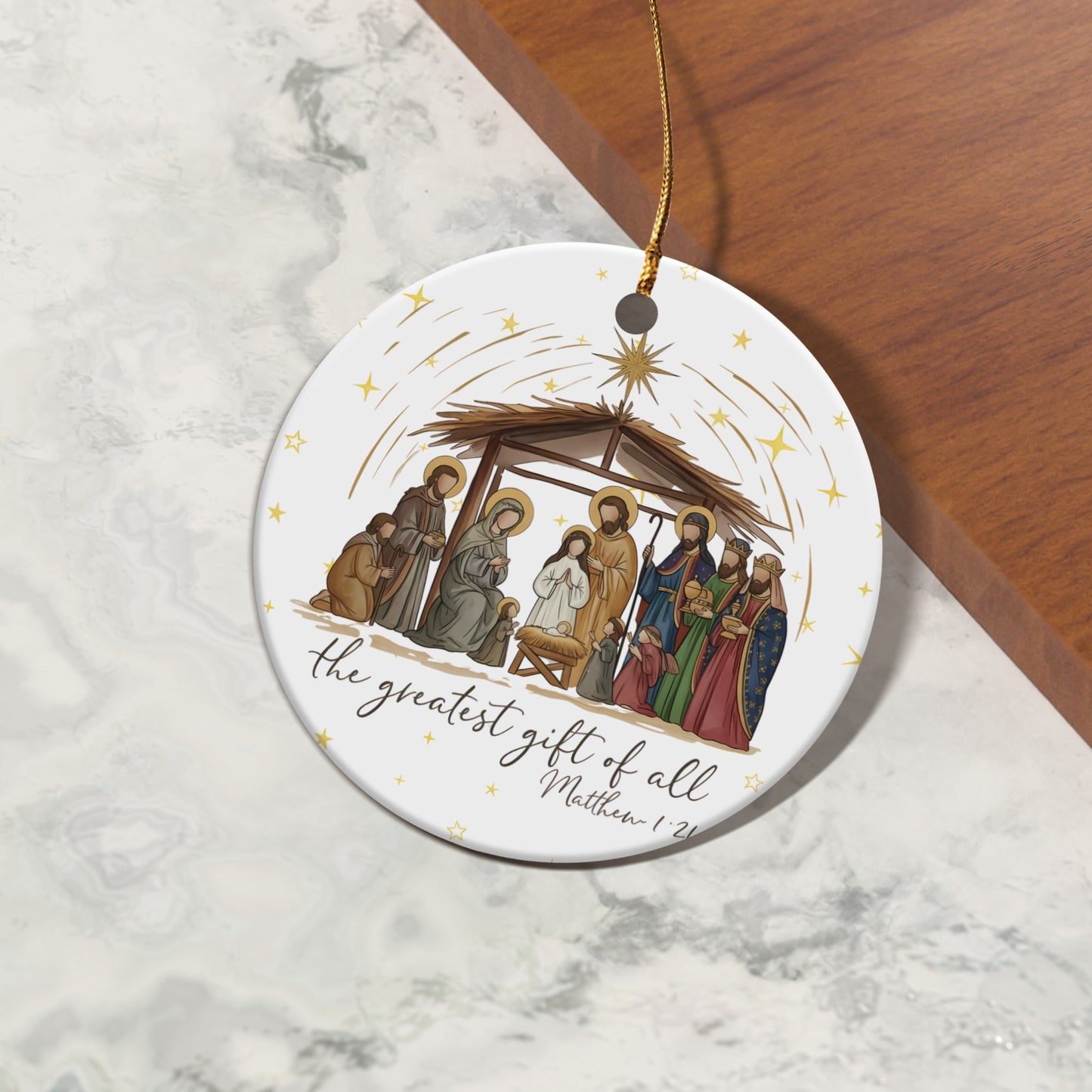 Christmas nativity scene ornament with text "the greatest gift of all"