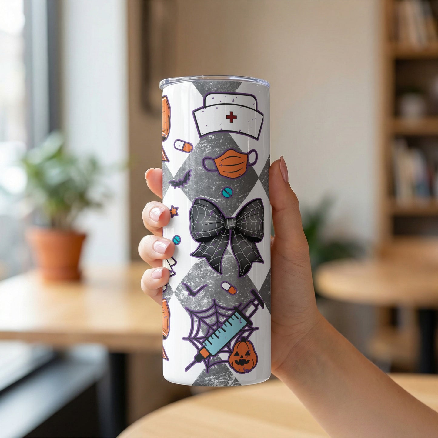 Tumbler with Halloween medical icons: nurse cap, mask, bow, syringe, pumpkin, bats, pills.