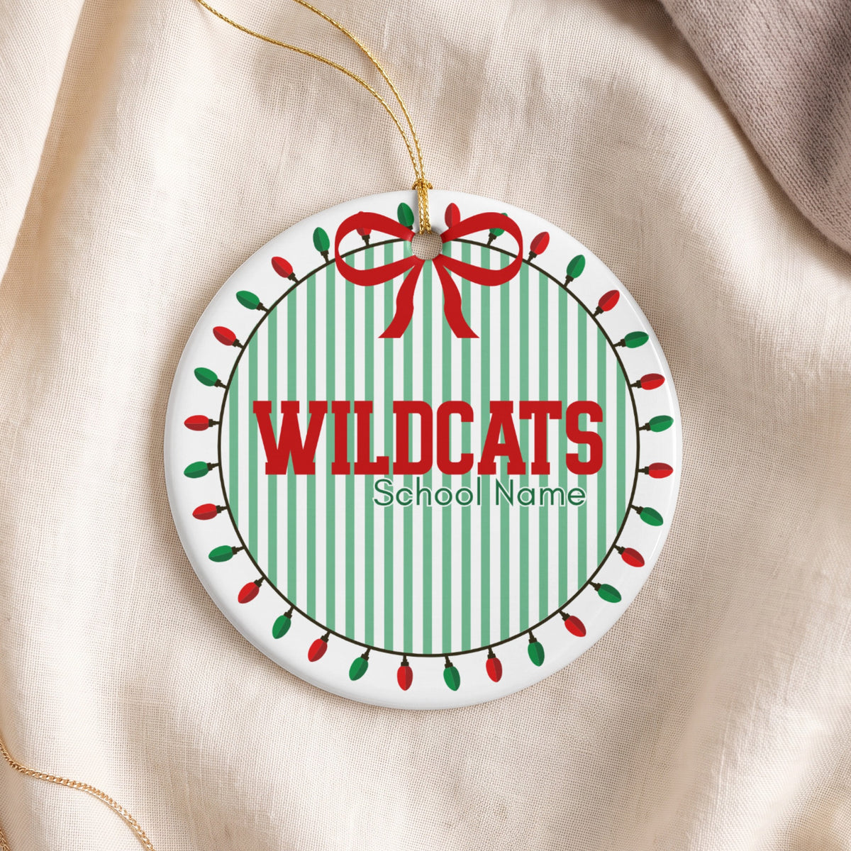Round ornament with "WILDCATS School Name" in red and green.