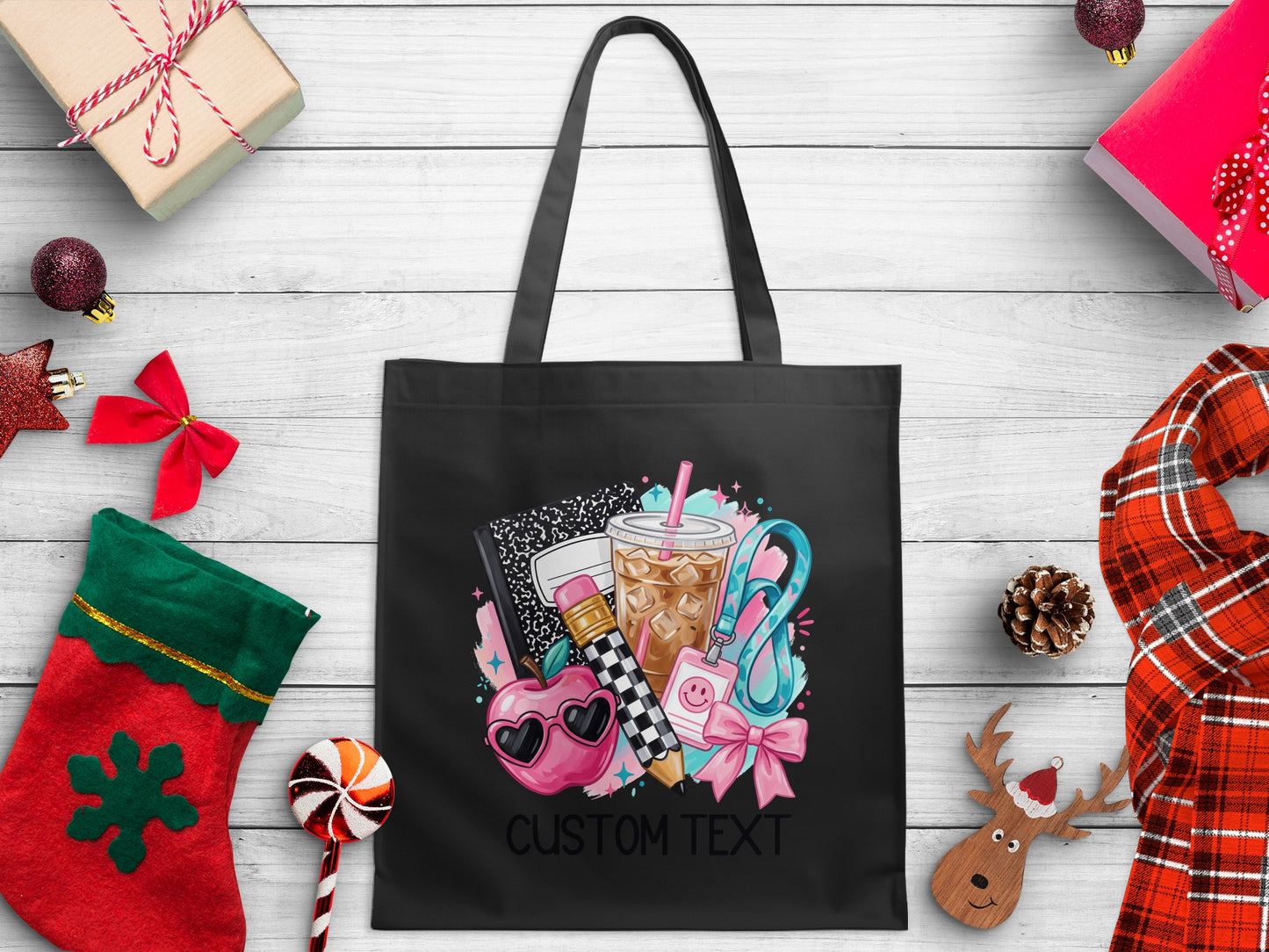 Black tote bag with school supplies graphic and "CUSTOM TEXT"