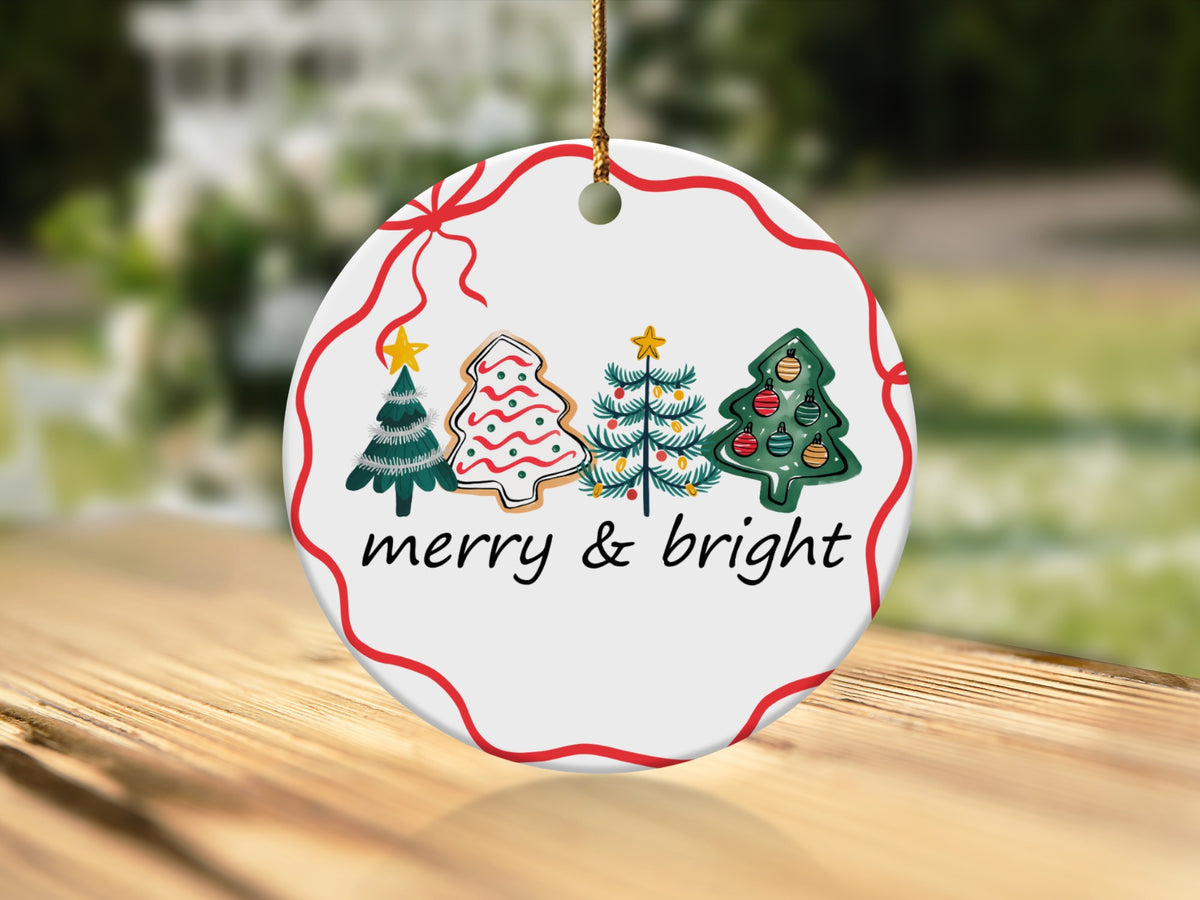 Round ornament with Christmas trees and "merry & bright" text.
