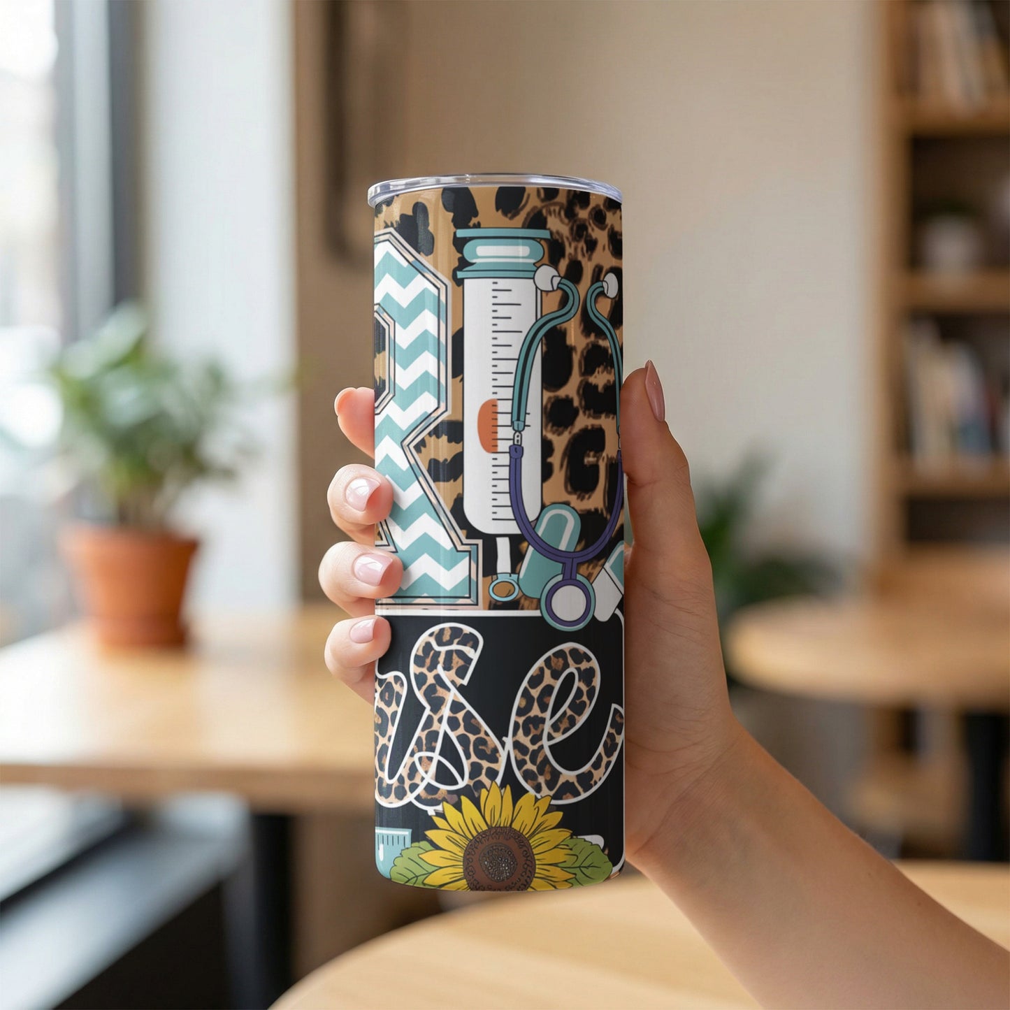 Tumbler with stethoscope, syringe, and "RN" and "se" text on leopard print background.