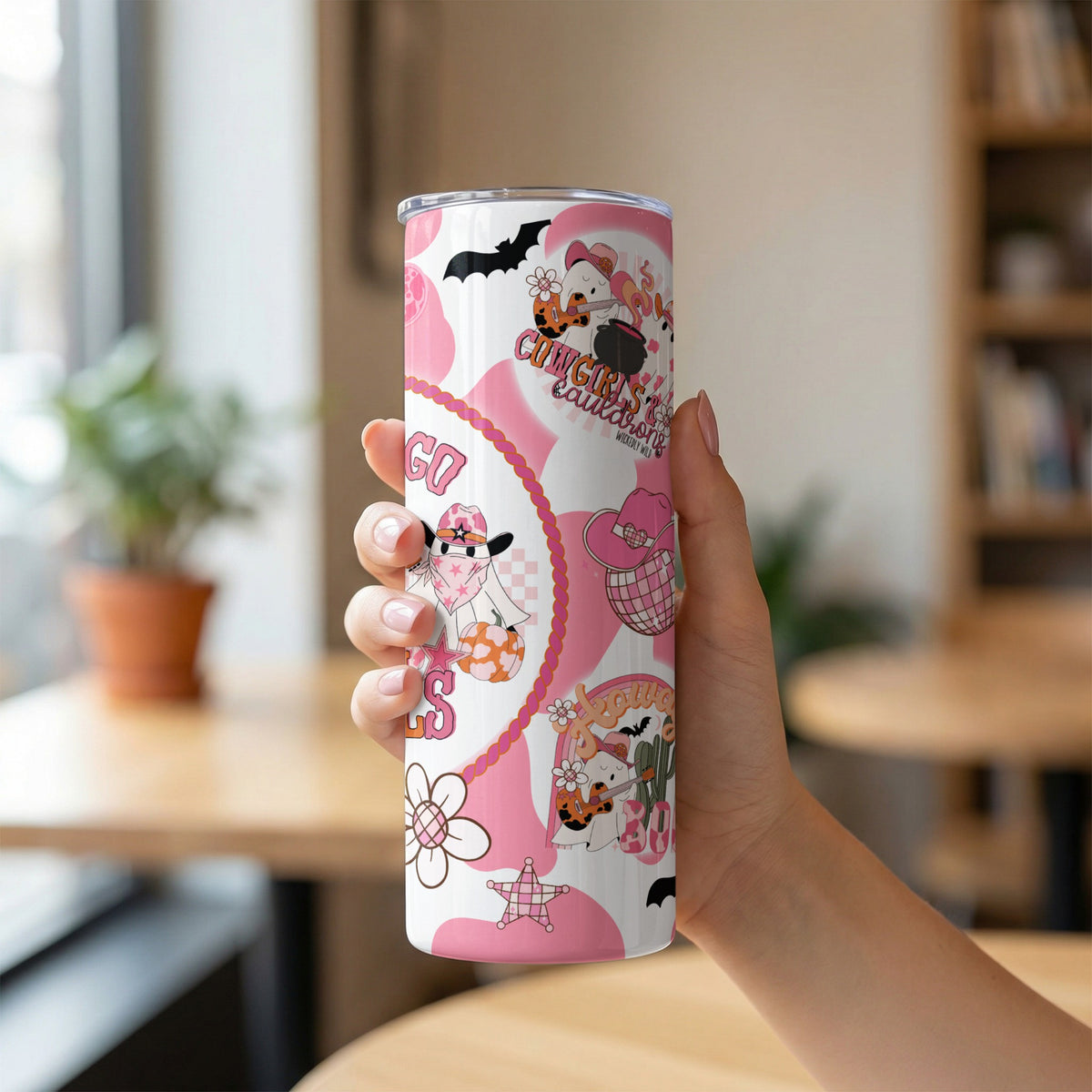 Tumbler with cute ghost cowgirls, bats, and pink cow print designs.