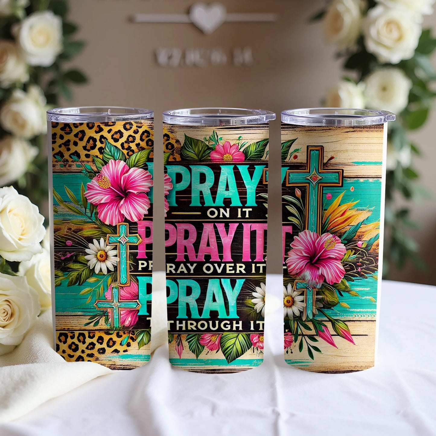 Floral tumbler with Christian cross and "Pray On It, Pray Over It, Pray Through It".