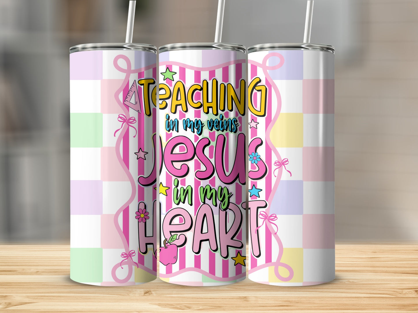 Tumbler with "Teaching in my veins Jesus in my heart" text and pastel checkered pattern.
