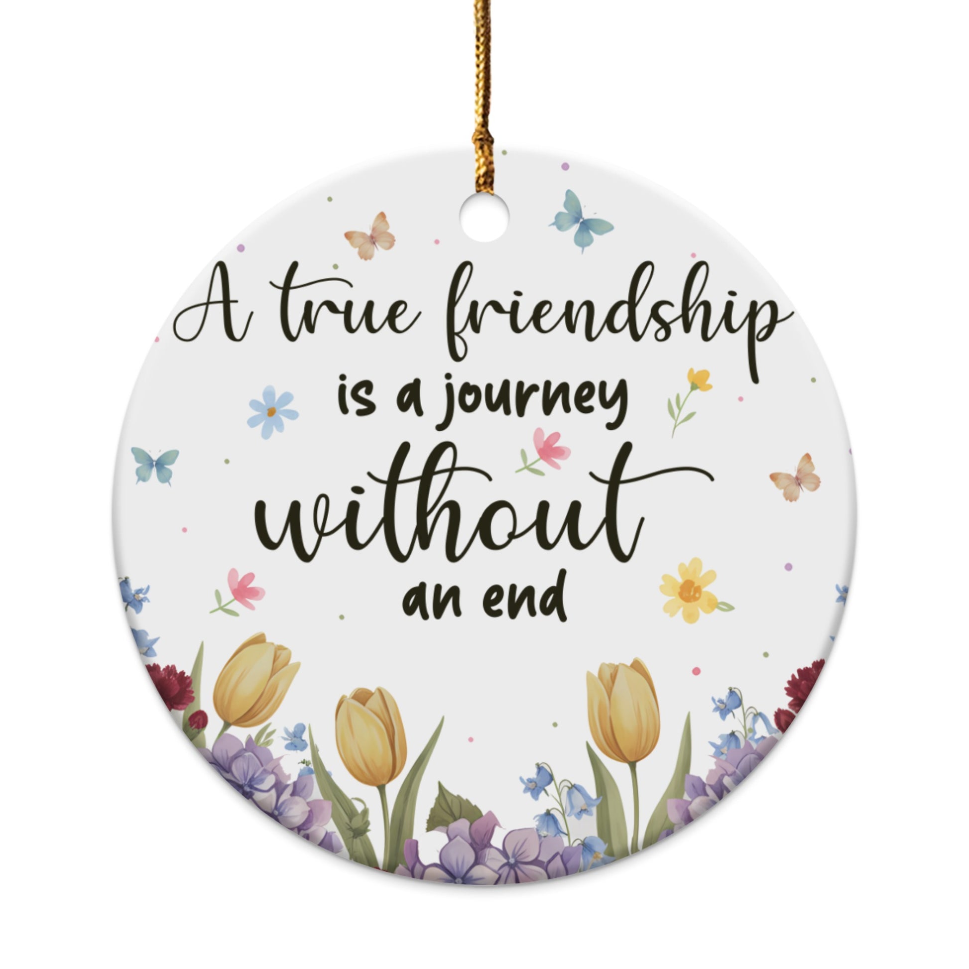 Round ornament with floral design and text "A true friendship is a journey without an end."