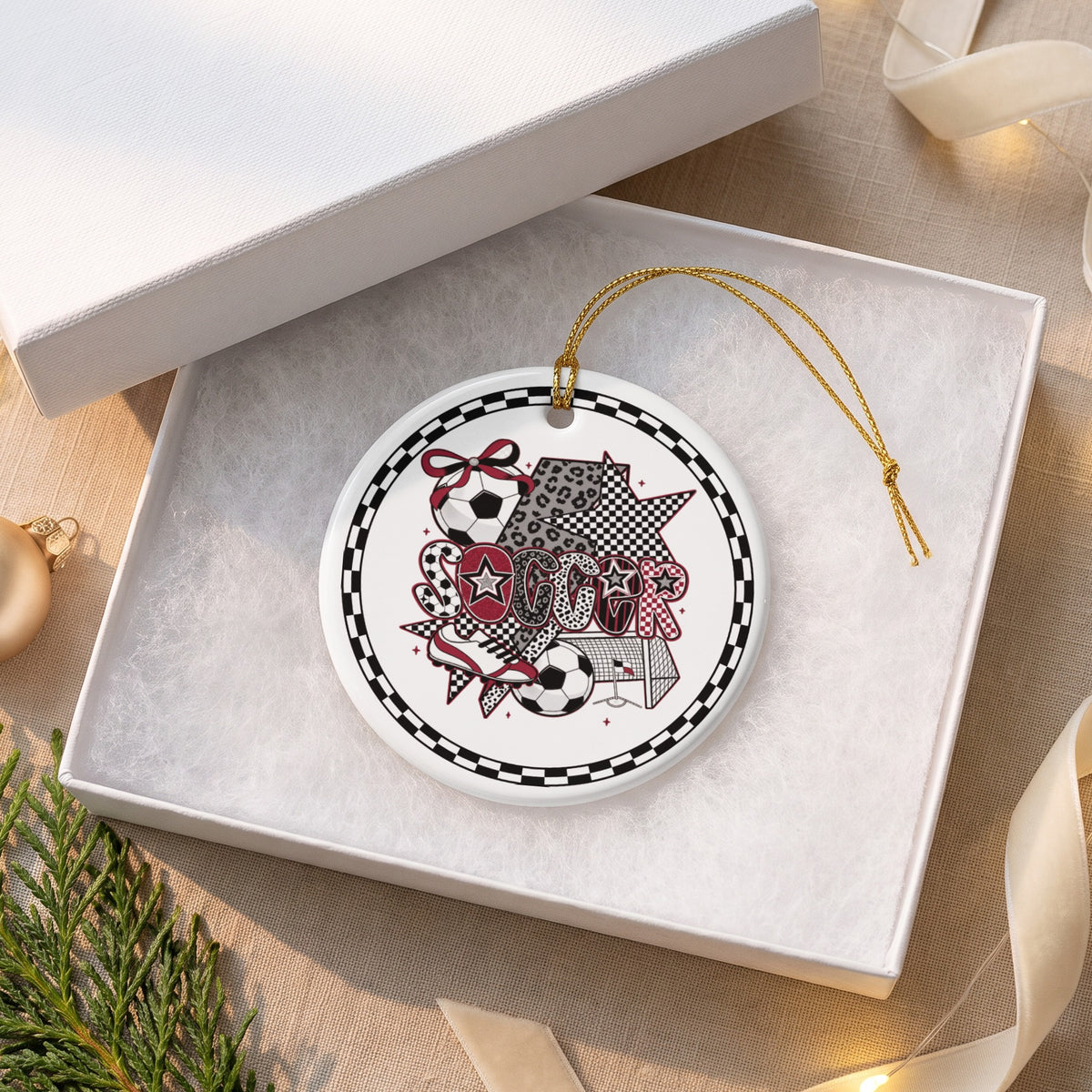 Round soccer-themed ornament with the word "SOCCER" in a collage of patterns.