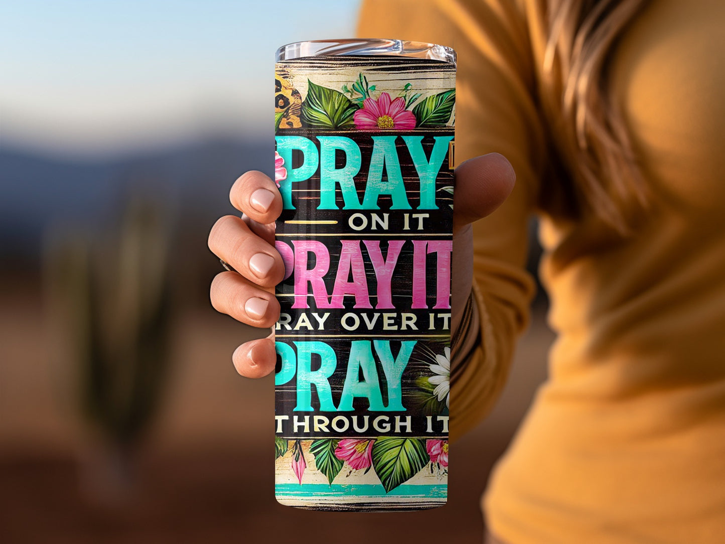 Tumbler with "PRAY ON IT, PRAY OVER IT, PRAY THROUGH IT" text and floral design.