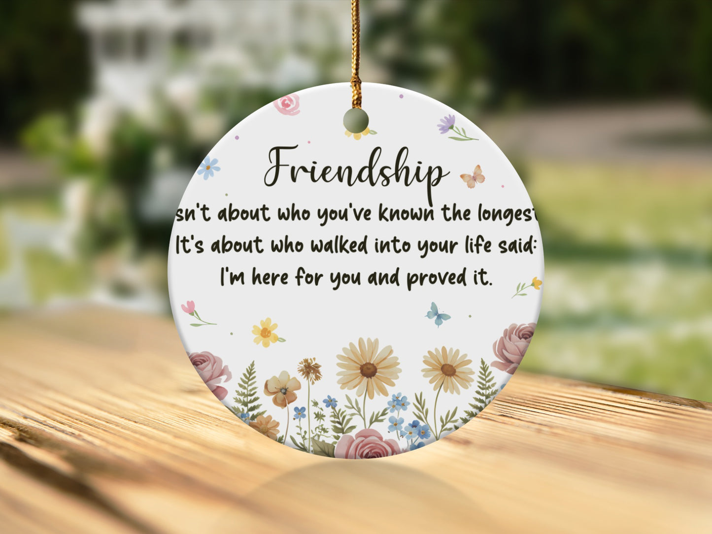 Ornament with "Friendship" and quote about true friends, surrounded by flowers.