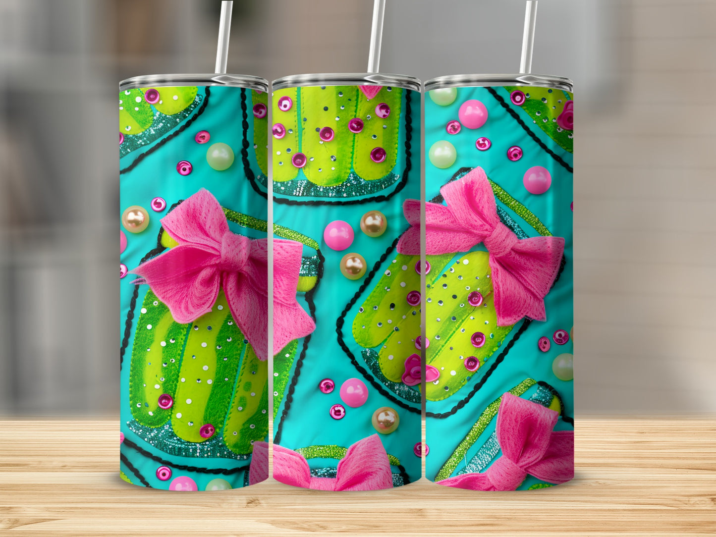 Three tumblers with a green polka dot gift box design and pink bows.