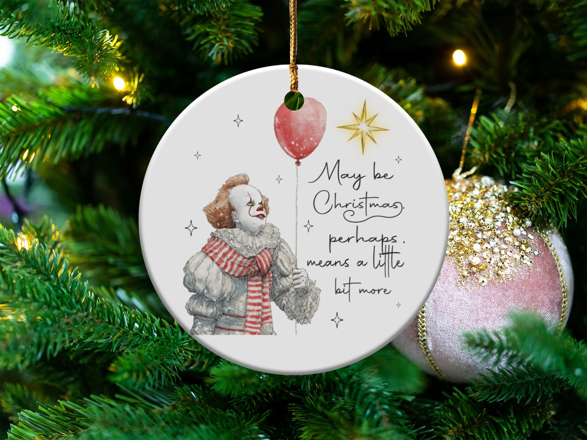 Ornament with clown, red balloon, and text "May be Christmas, perhaps, means a little bit more."