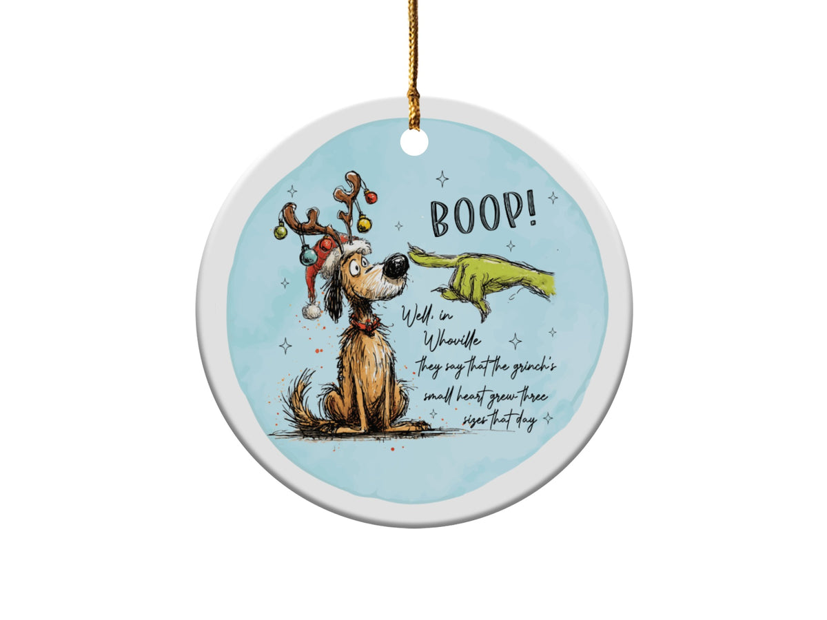 Grinch hand booping dog with antlers and Santa hat, text "BOOP!"