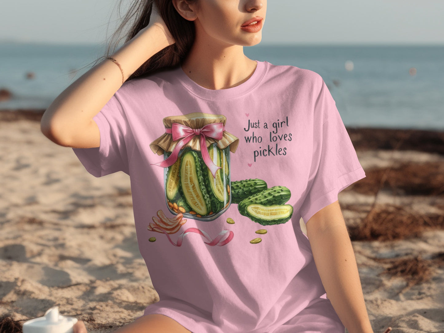 Pink t-shirt with "Just a girl who loves pickles" and a pickle jar illustration.