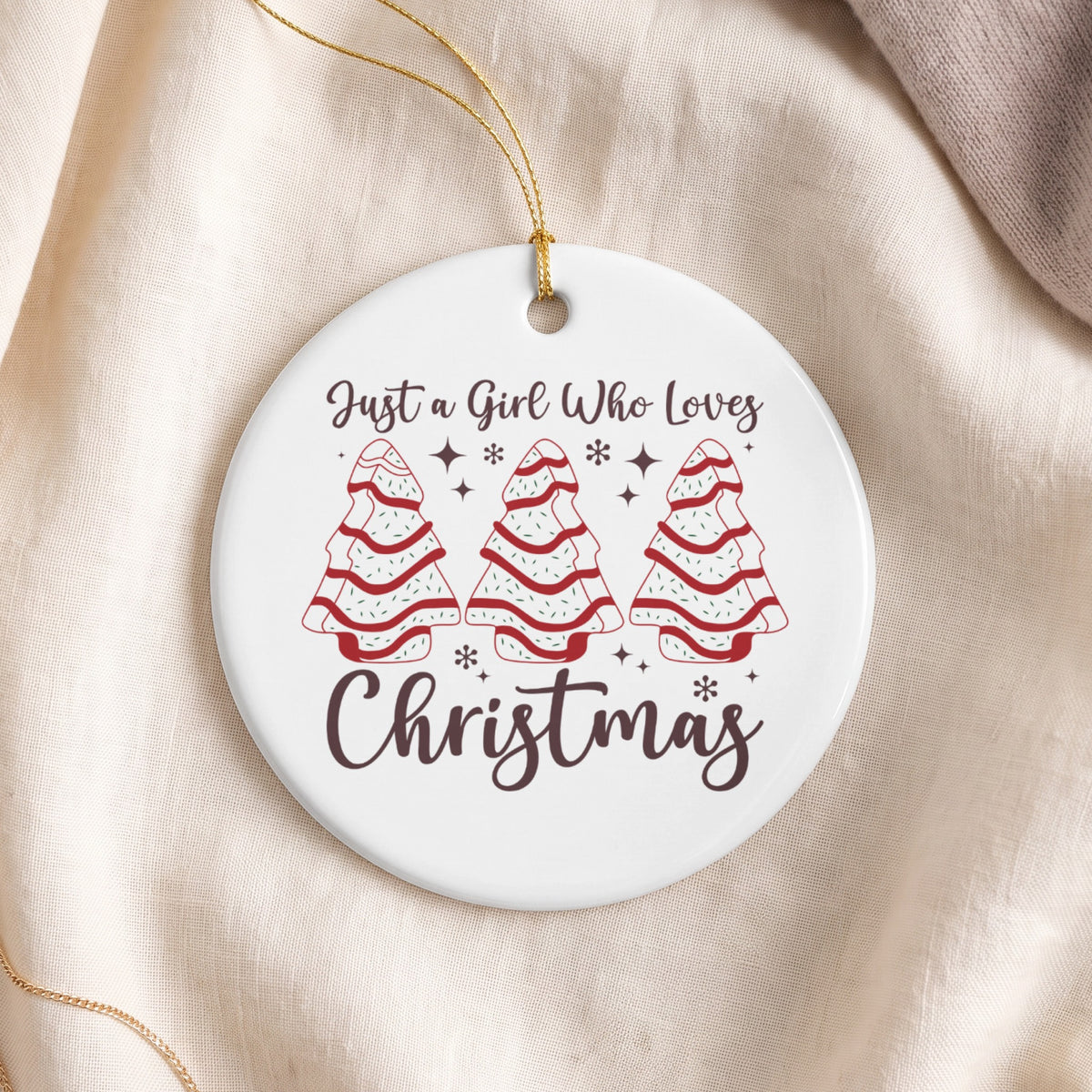 Round ornament with Christmas trees and text "Just a Girl Who Loves Christmas".
