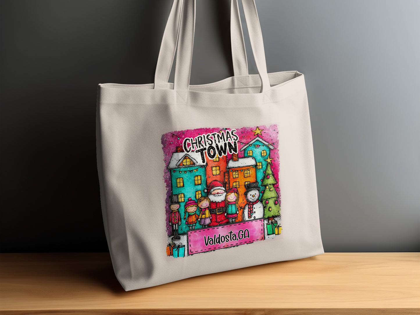 Tote bag with watercolor illustration of Christmas Town, Santa, snowman, and "Valdosta, GA" text.