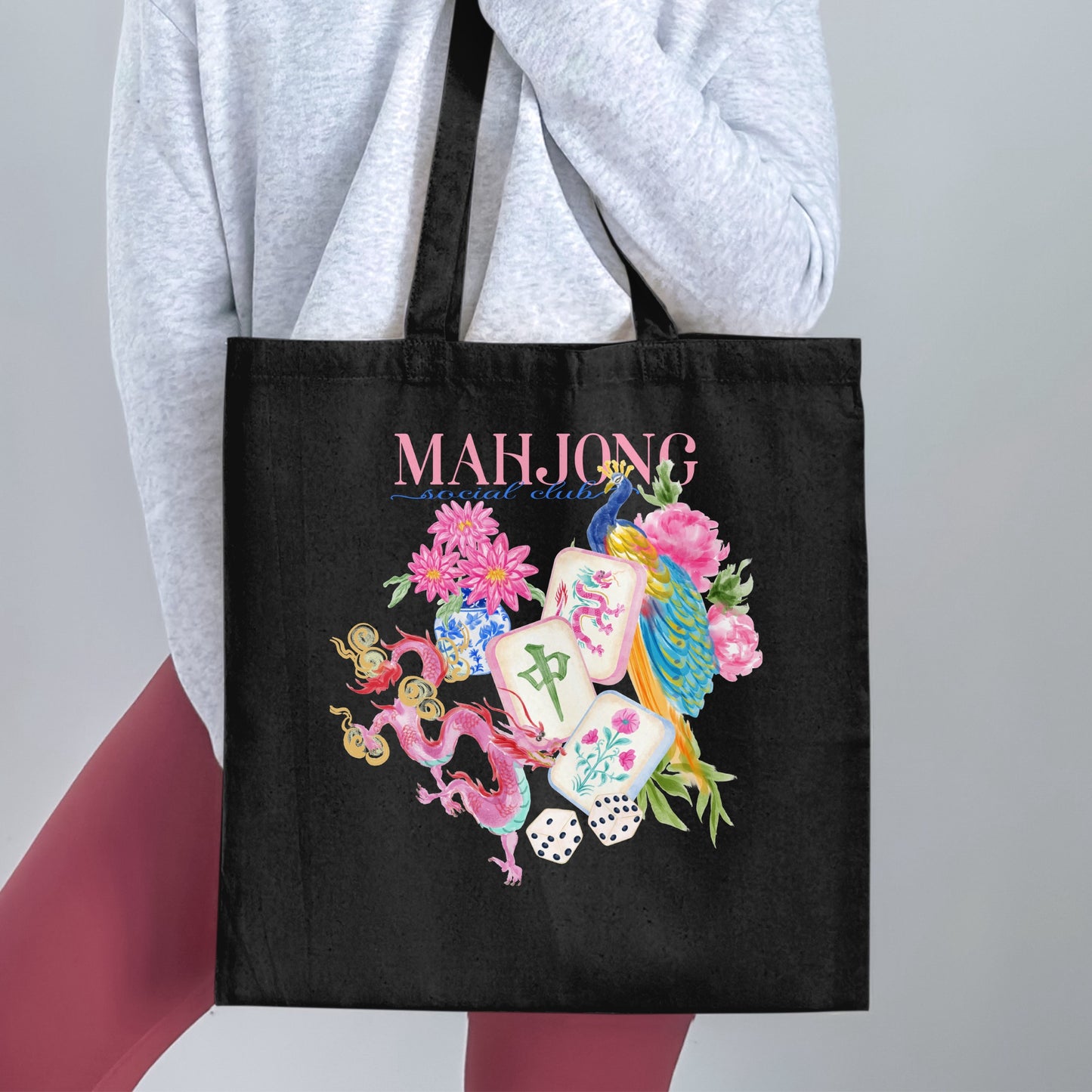 Black tote bag with "MAHJONG social club" text and watercolor art.