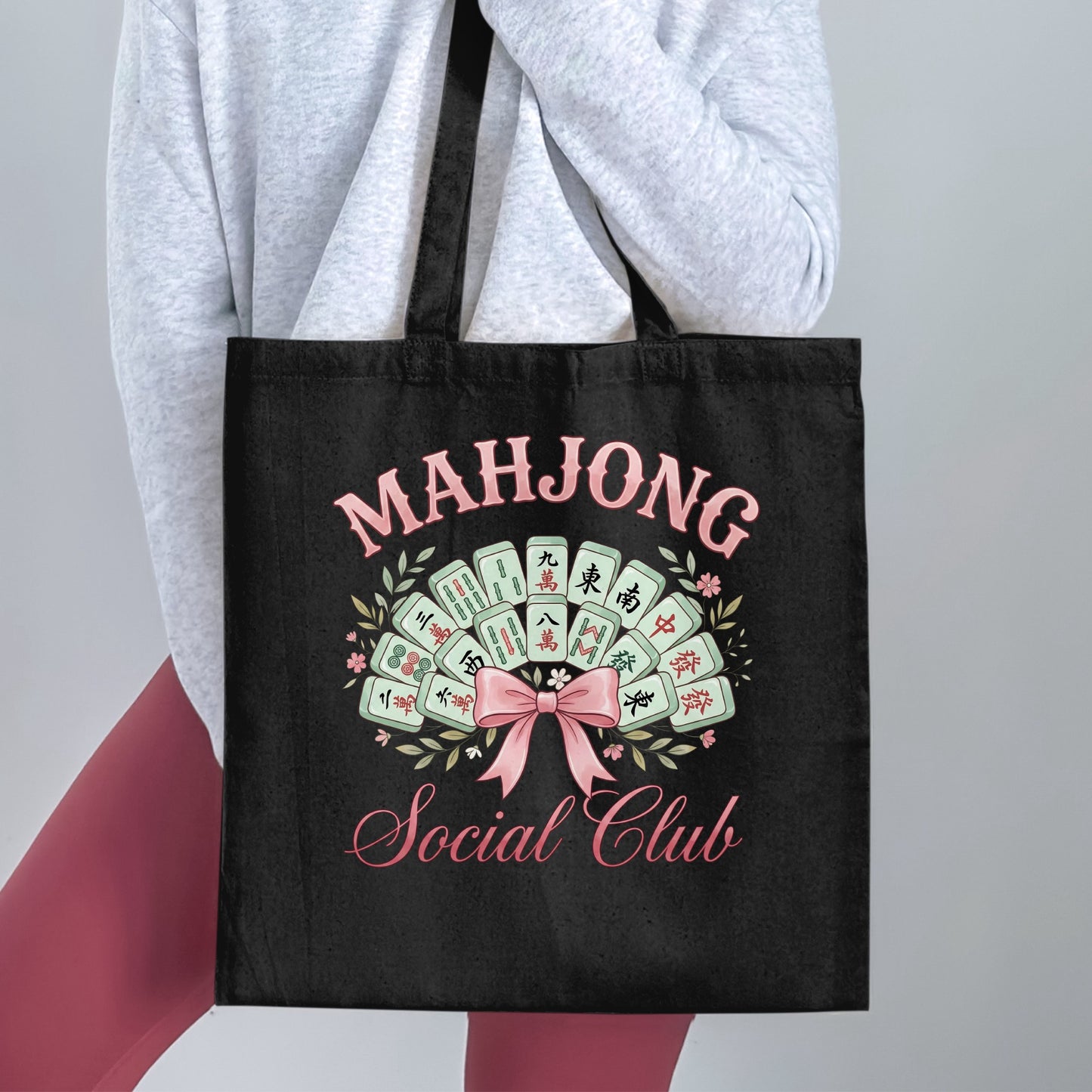 Black tote bag with "Mahjong Social Club" text and mahjong tiles.