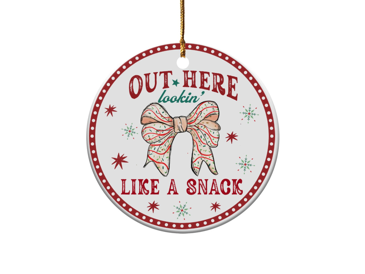 Round ornament with red border and text "OUT HERE lookin' LIKE A SNACK".