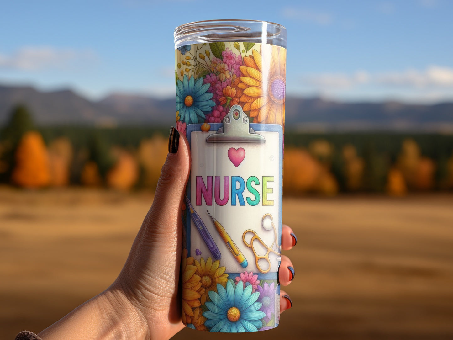 Tumbler with colorful floral design and "NURSE" text, held by a hand.