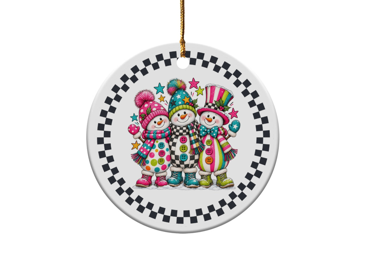 Three cheerful snowmen with colorful hats, scarves, and boots on a round ornament.