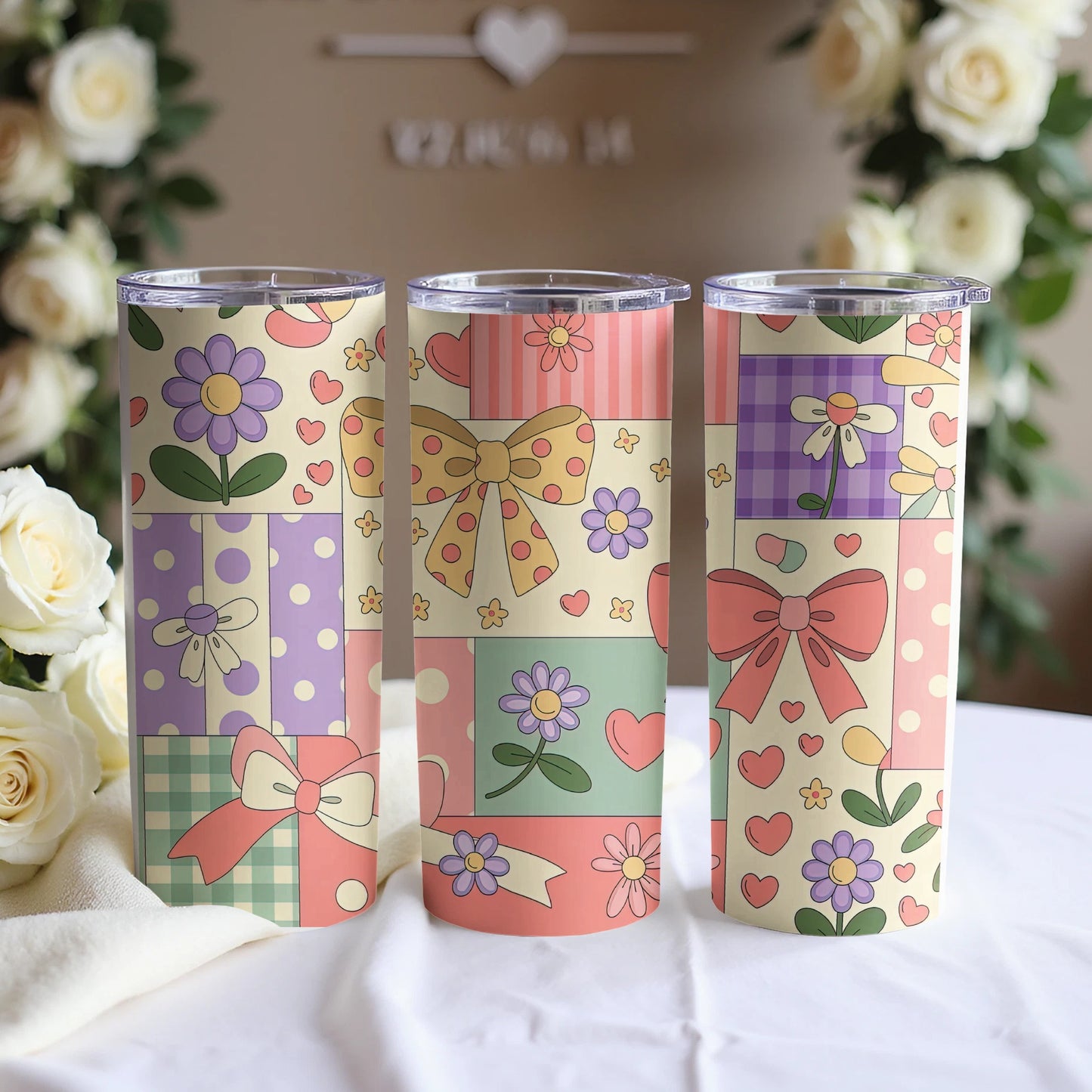 Three tumblers with floral and patchwork designs in pastel colors.