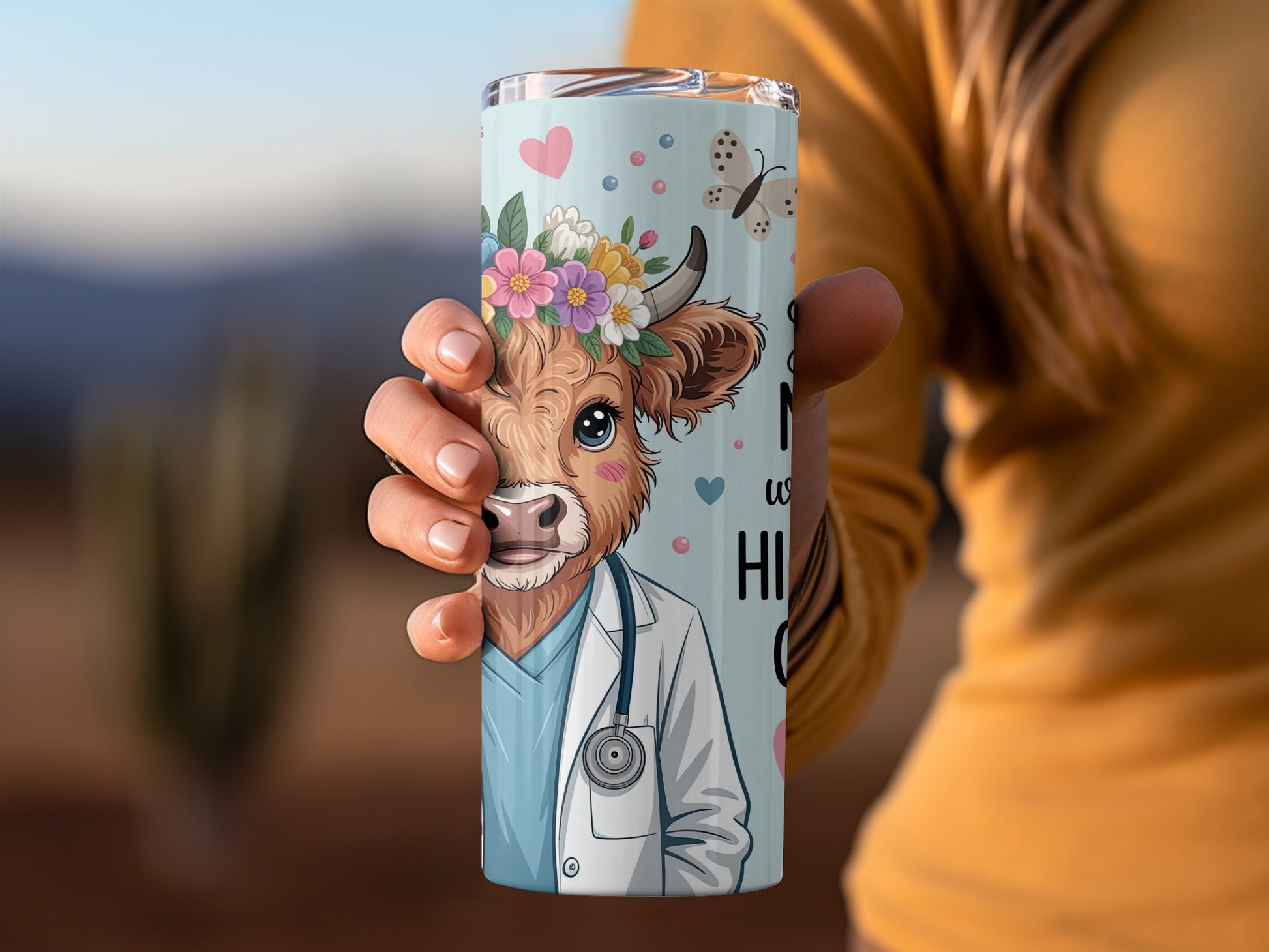 Cow wearing stethoscope and flower crown, with butterflies.