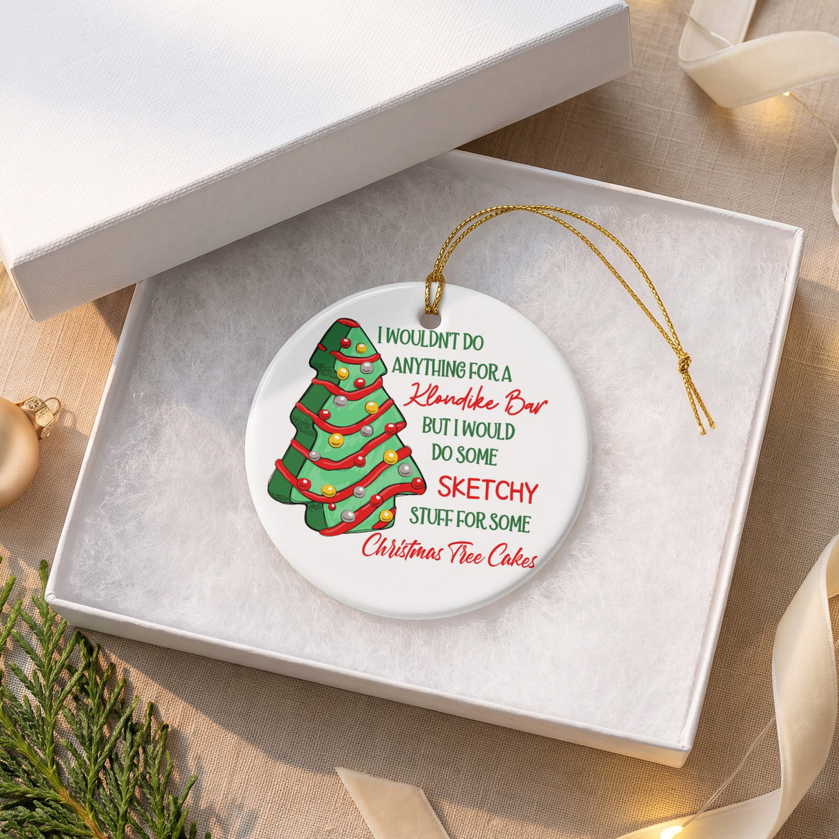 Round ornament with Christmas tree illustration and text about Klondike Bars and Christmas Tree Cakes.