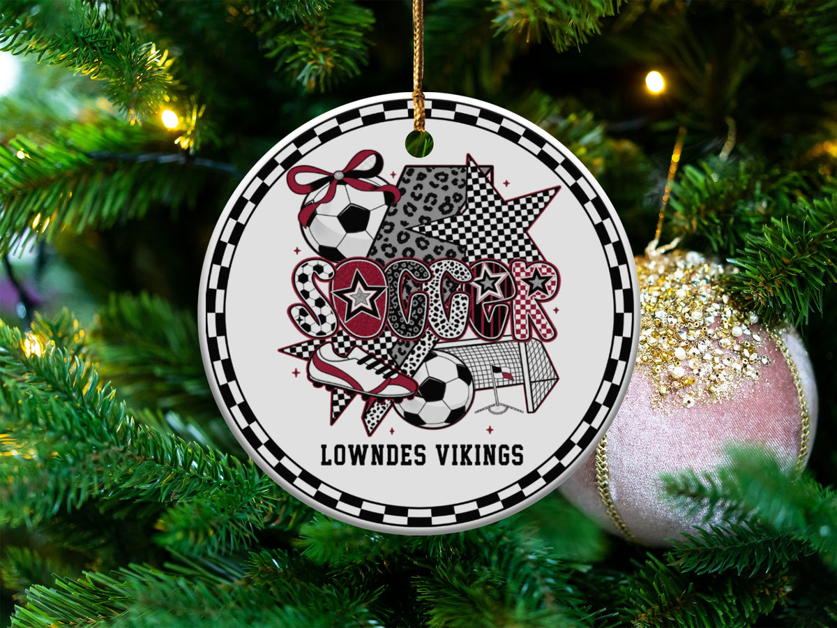 Soccer ornament with "Lowndes Vikings" text and soccer motifs, on a Christmas tree.