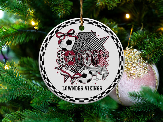 Soccer ornament with "Lowndes Vikings" text and soccer motifs, on a Christmas tree.