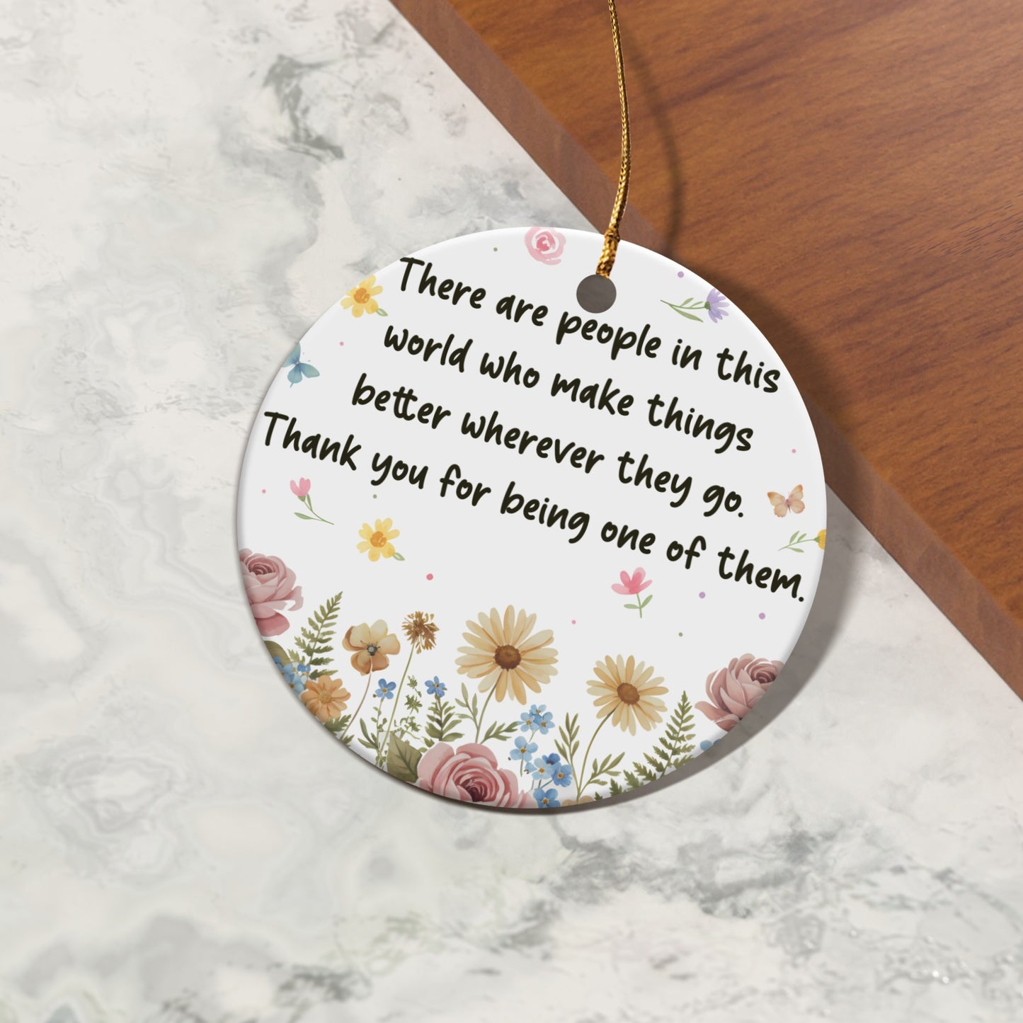 Round ornament with floral design and quote "Thank you for being one of them."