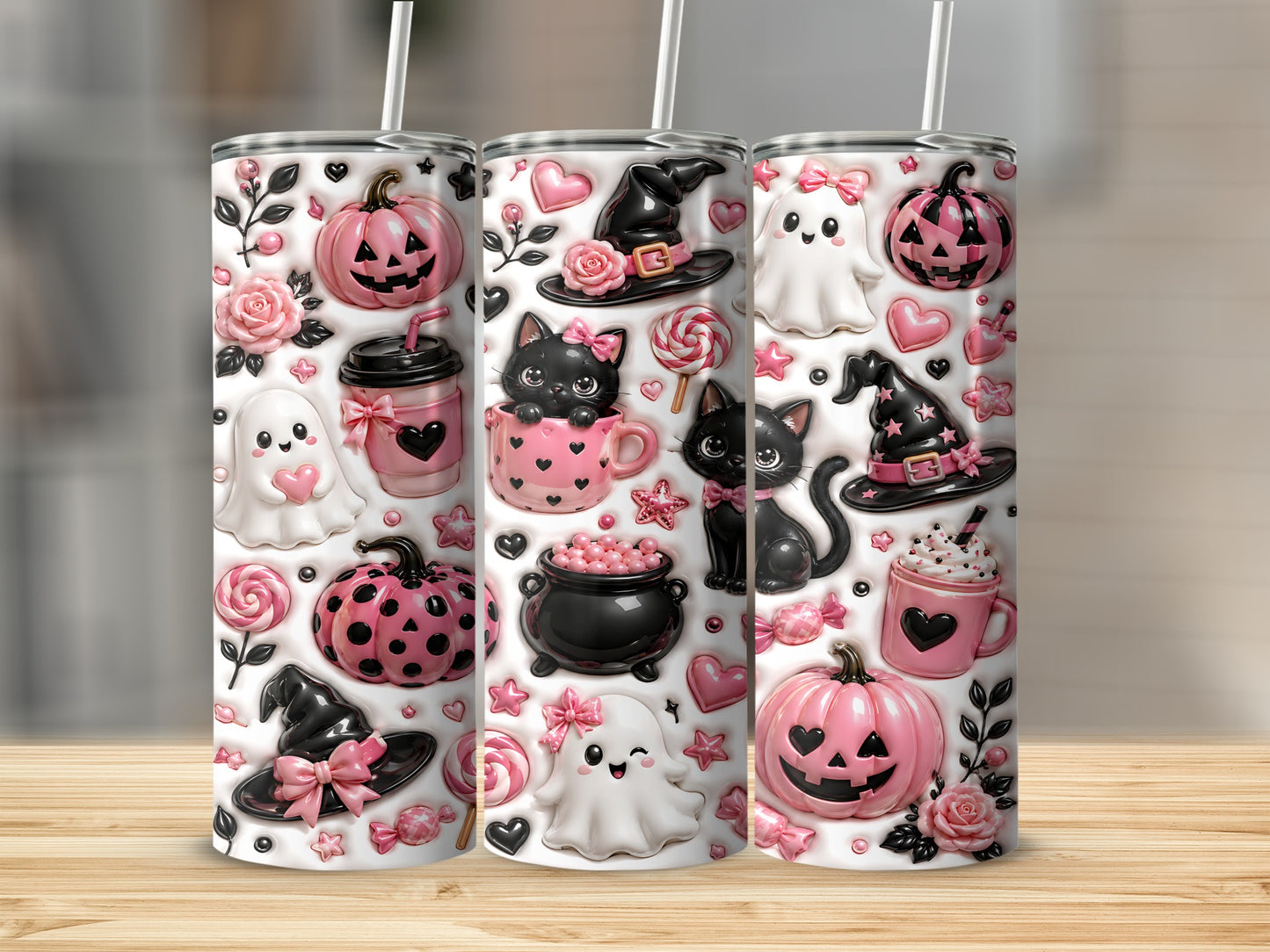 Pink and black Halloween themed tumblers with ghosts, pumpkins, cats, and witch hats.