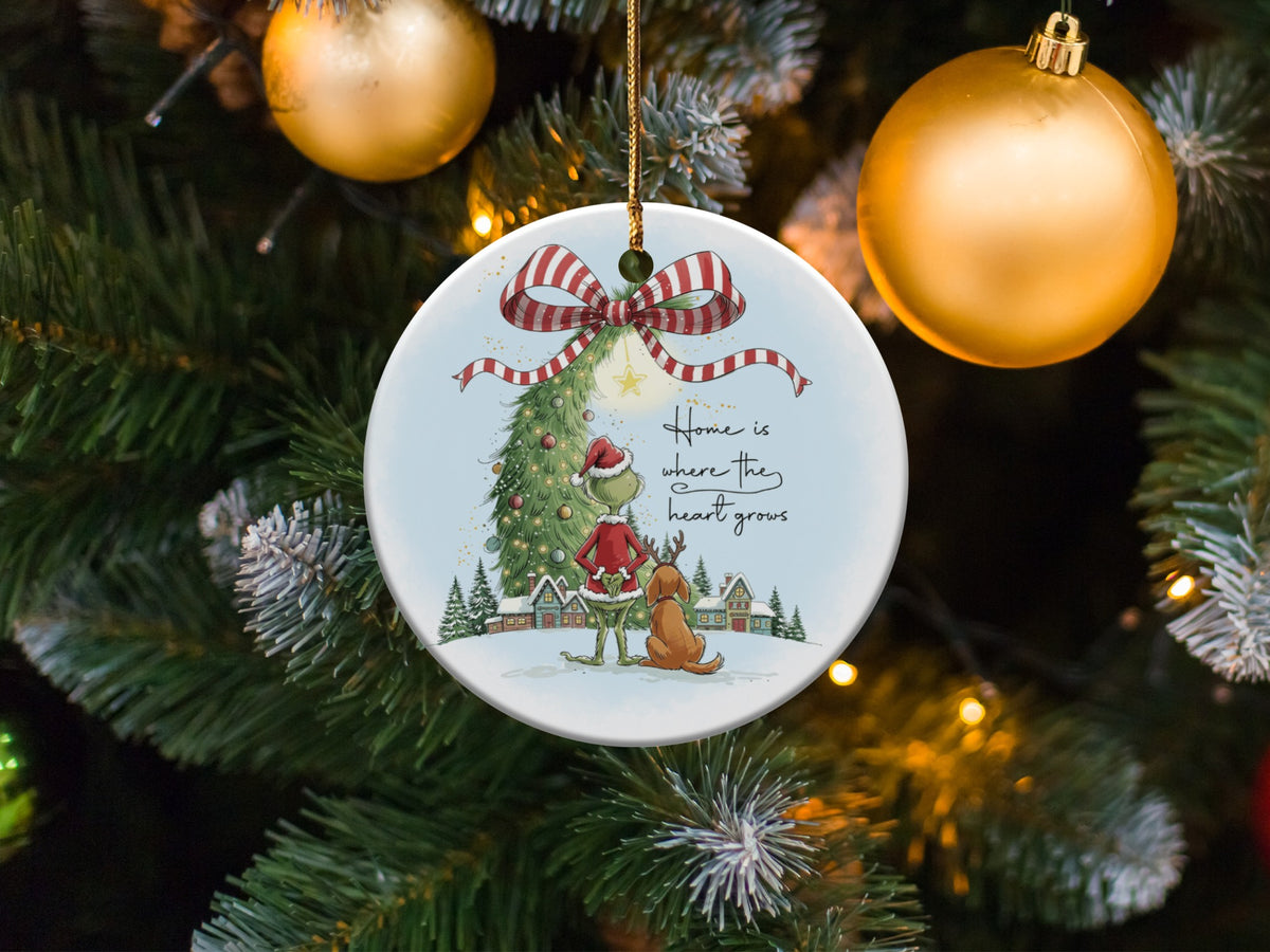 Round ornament with Grinch and dog, and text "Home is where the heart grows."