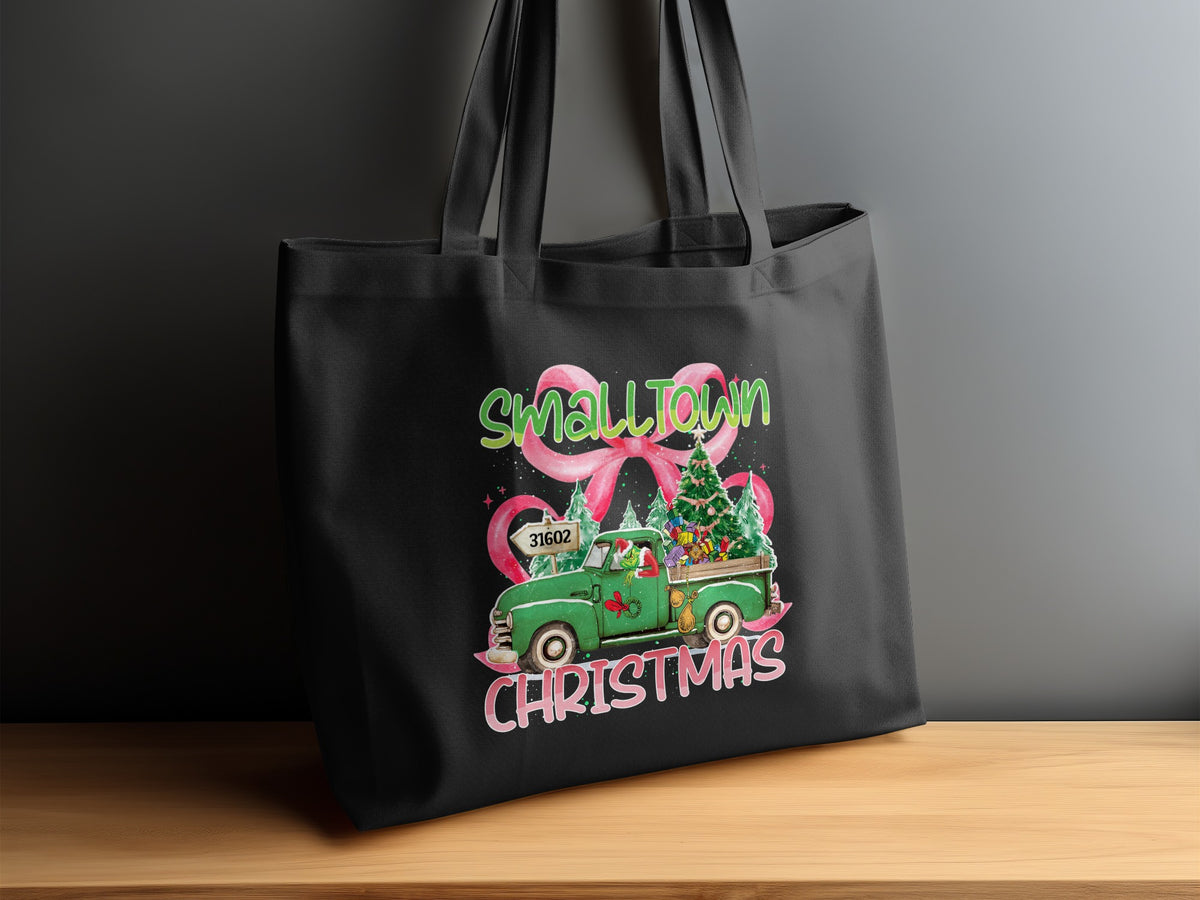 Black tote bag with "SmallTown Christmas" design featuring a green truck and Christmas tree.