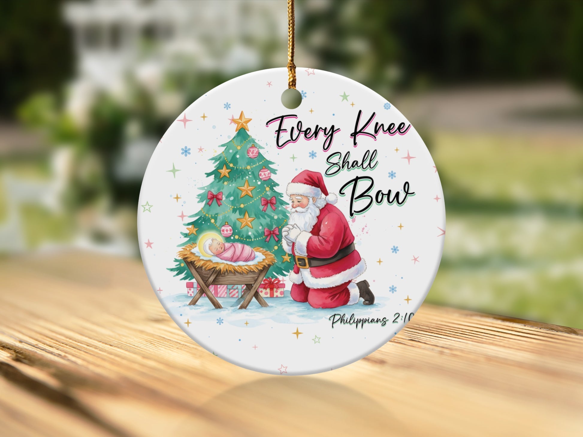 Round ornament with Santa kneeling by Jesus, a Christmas tree, and "Every Knee Shall Bow".