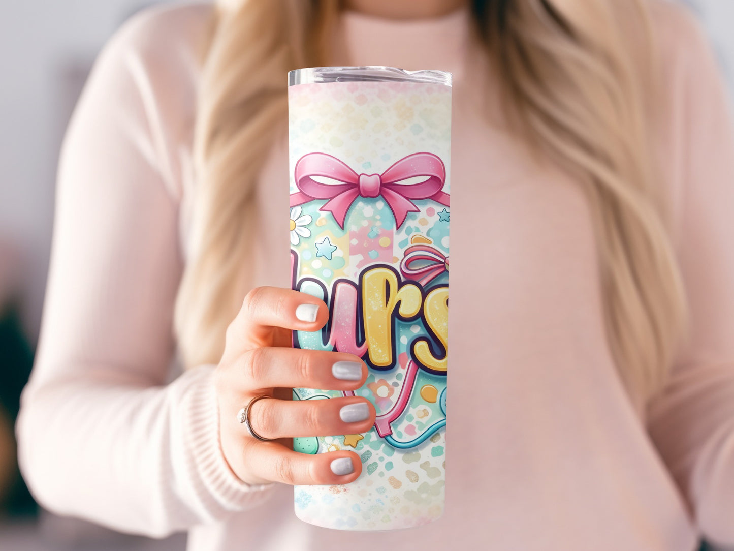 Tumbler with pastel floral pattern, bow, and "Nurse" text.