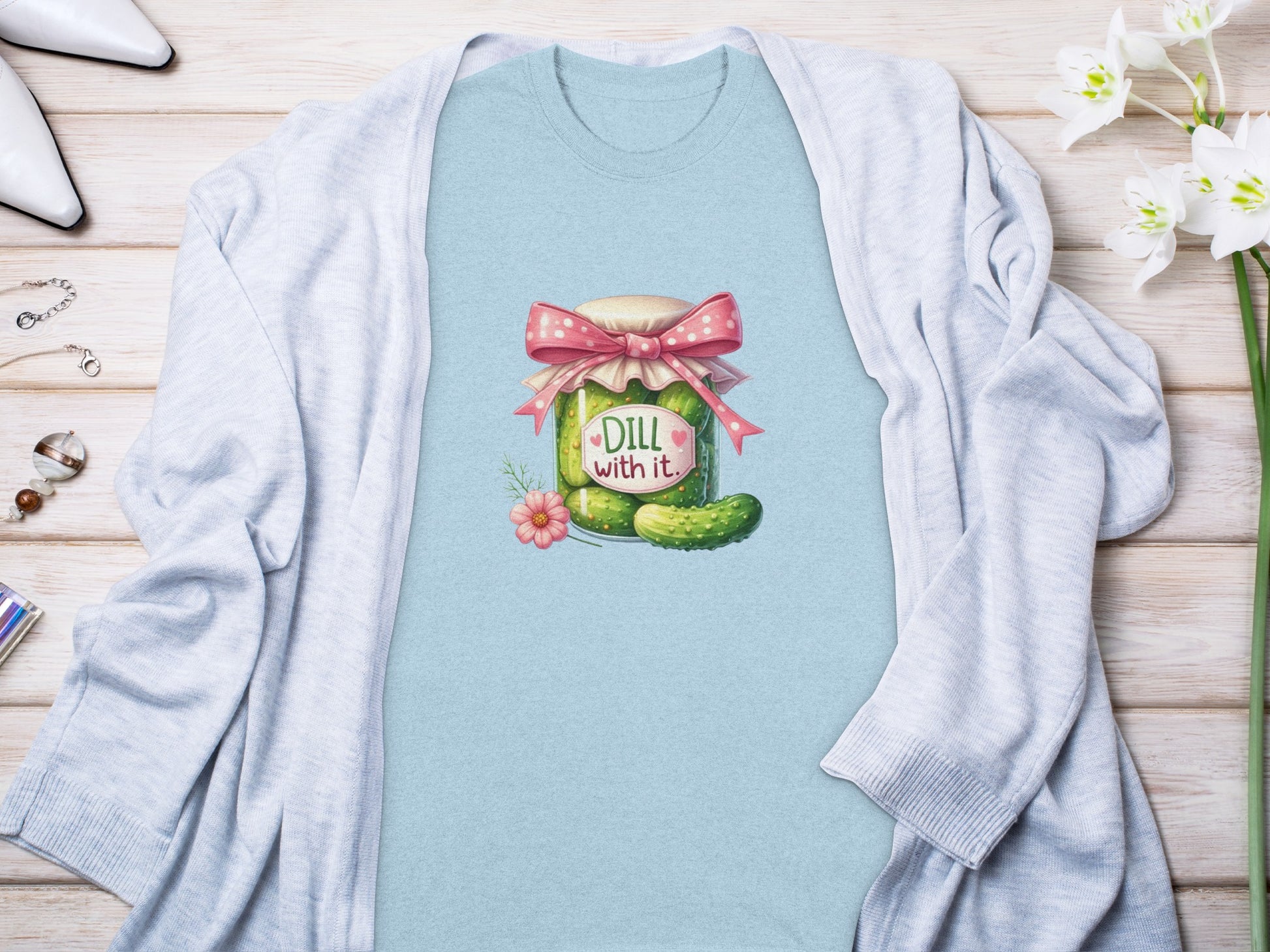 Blue t-shirt with a cartoon jar of pickles and "Dill with it" text.