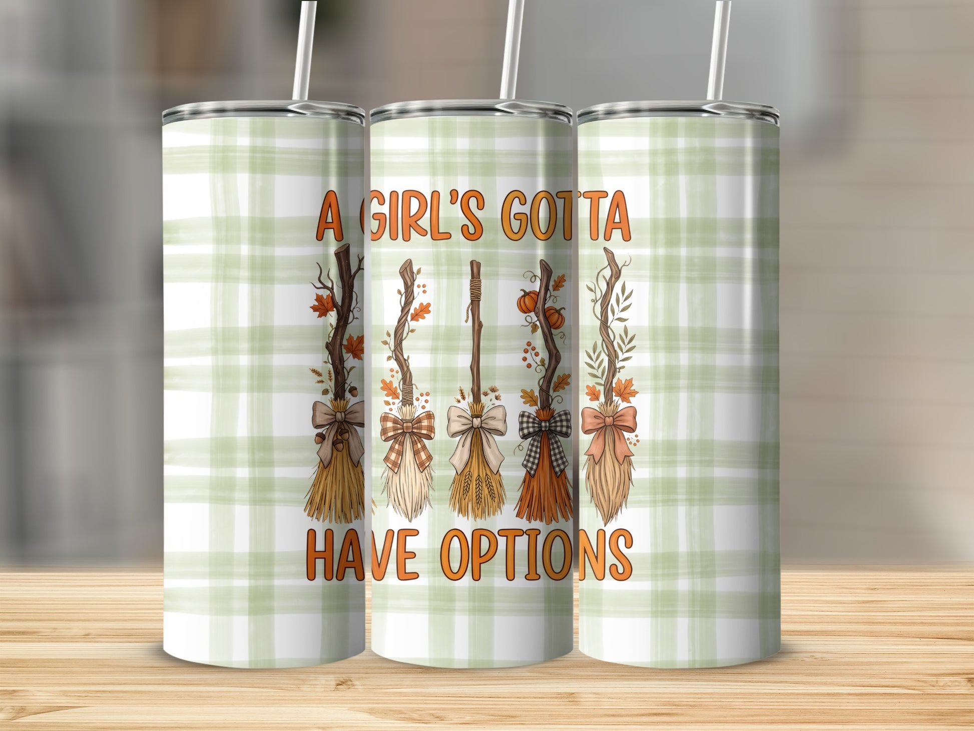 Tumbler with fall brooms and text "A girl's gotta have options".