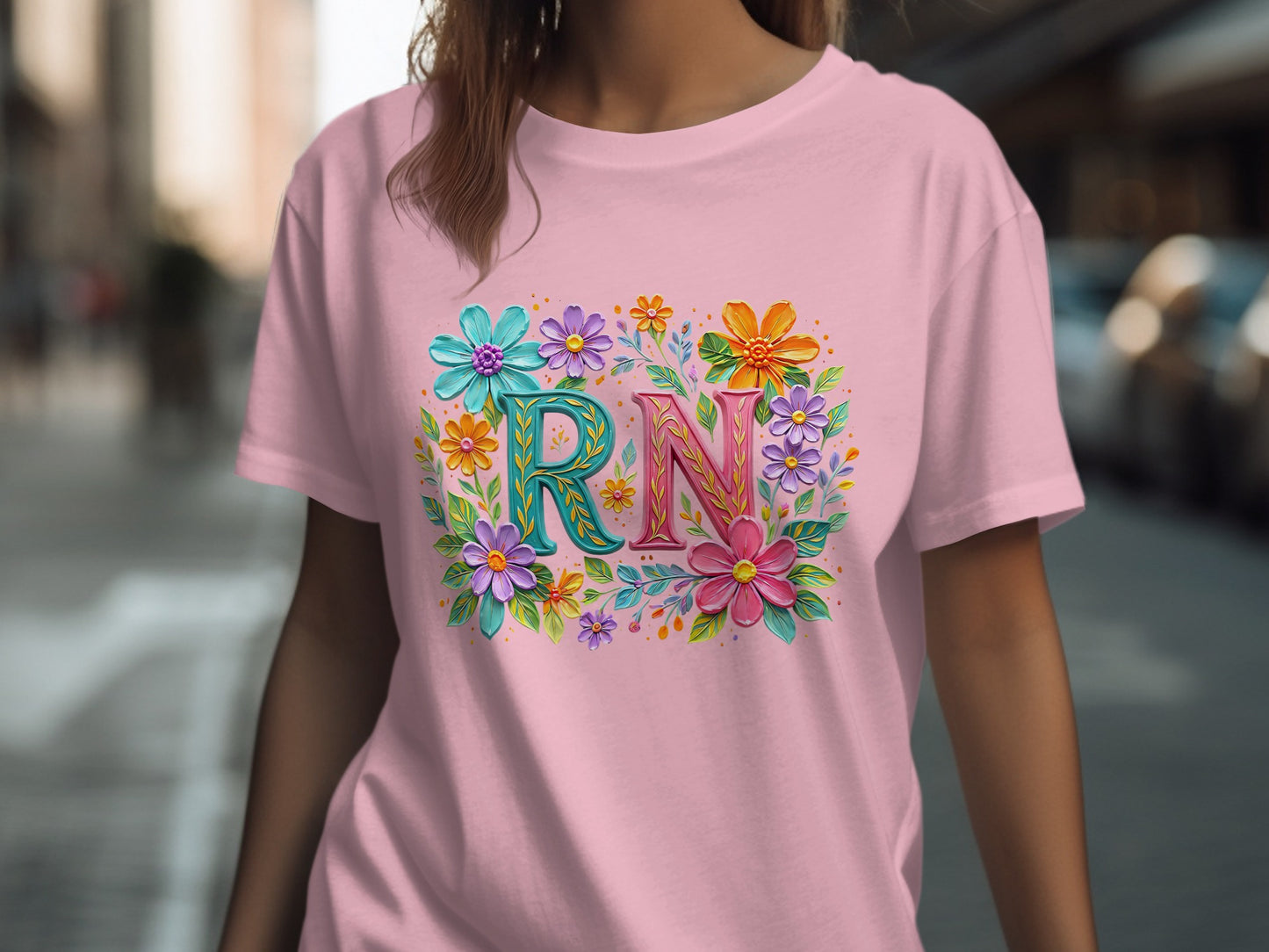 Pink t-shirt with "RN" in colorful floral letters.