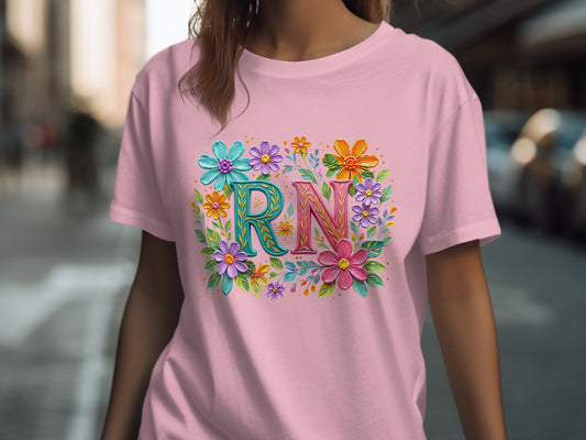 Pink t-shirt with "RN" in colorful floral letters.