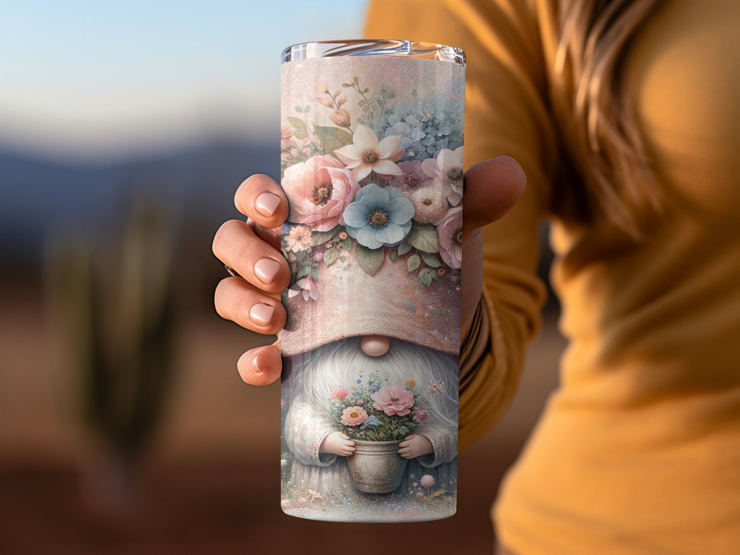 Gnome holding a pot of flowers, wrapped around a tall tumbler.