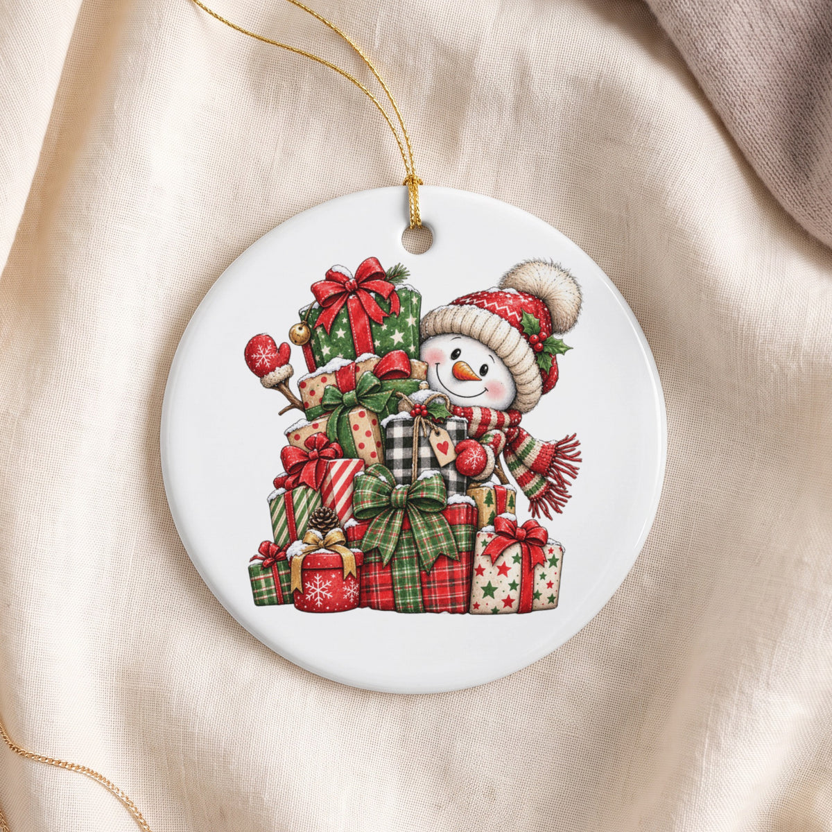 Round ornament with a smiling snowman in a Santa hat surrounded by gifts.