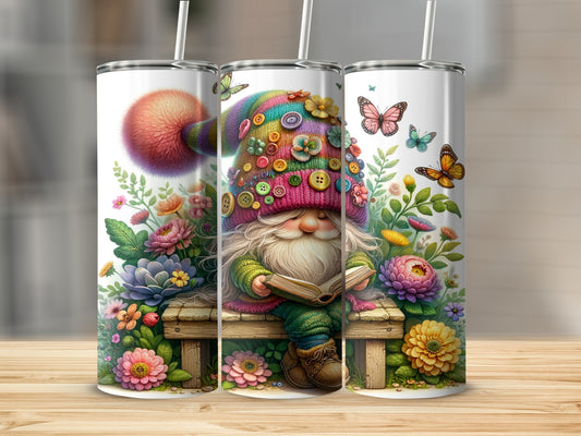 Gnome reading a book on a bench surrounded by flowers and butterflies.